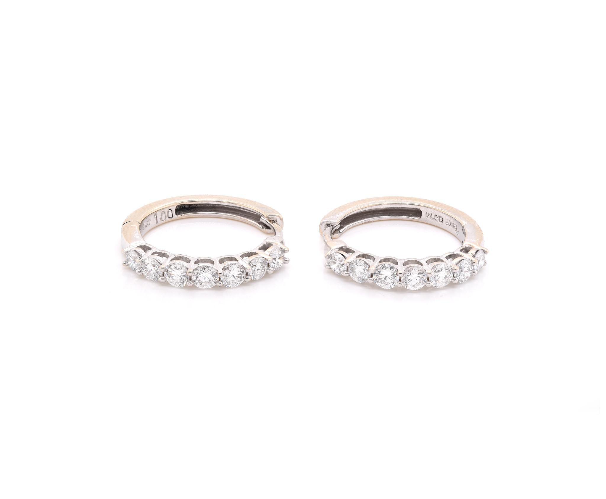 Designer: custom
Material: 14K white gold
Diamonds: 14 round brilliant cut = 1.00cttw
Color: G
Clarity: SI1
Dimensions: earrings measure 18mm long
Weight: 4.33 grams
