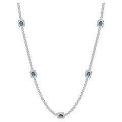 Collier en or blanc 14 carats avec chaînes de saphirs