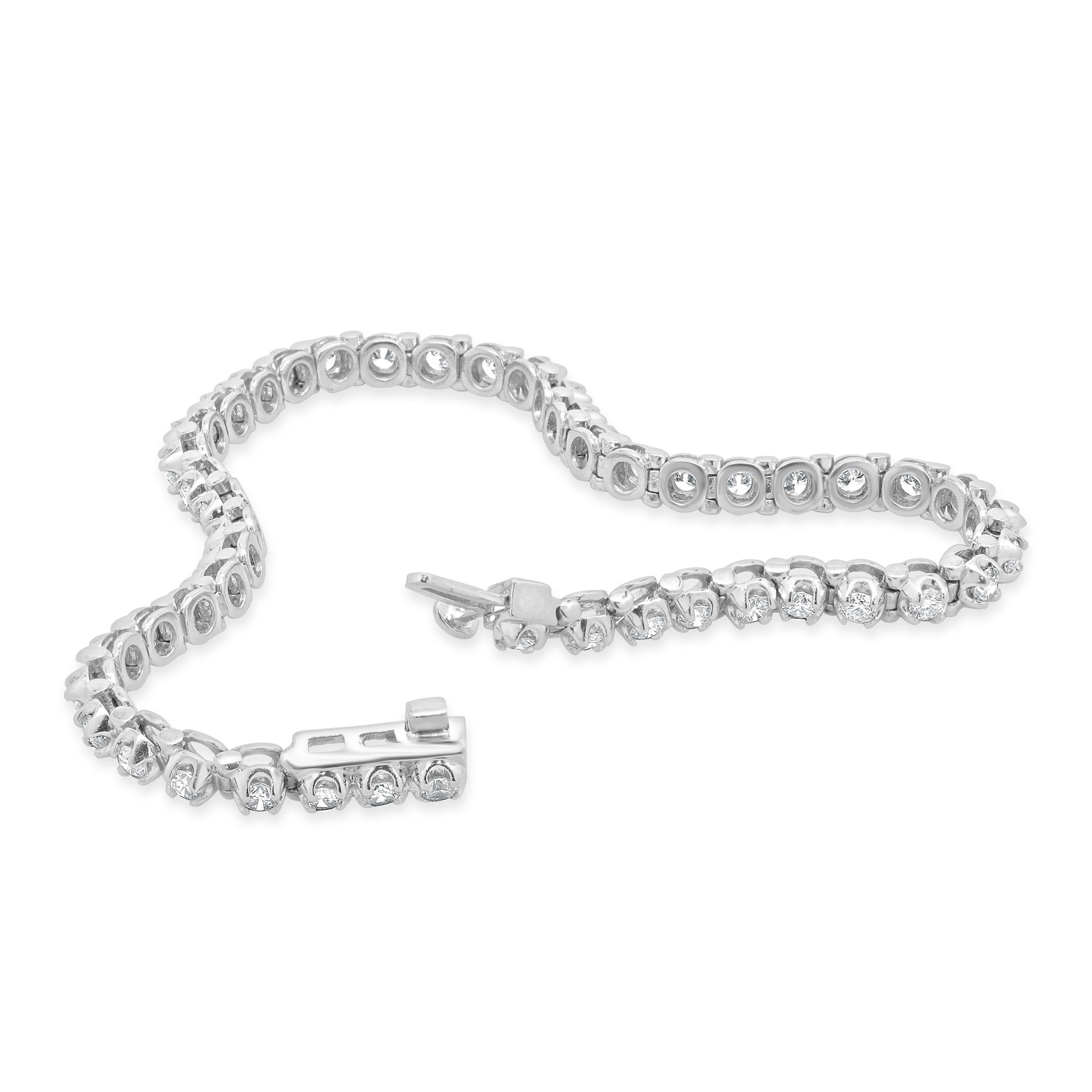 Designer: custom design
Material: 14K White gold
Diamond: 47 round brilliant cut = 3.00cttw
Color: H / I
Clarity: I1-2
Dimensions: bracelet will fit up to a 7-inch wrist
Weight: 12.30 grams
