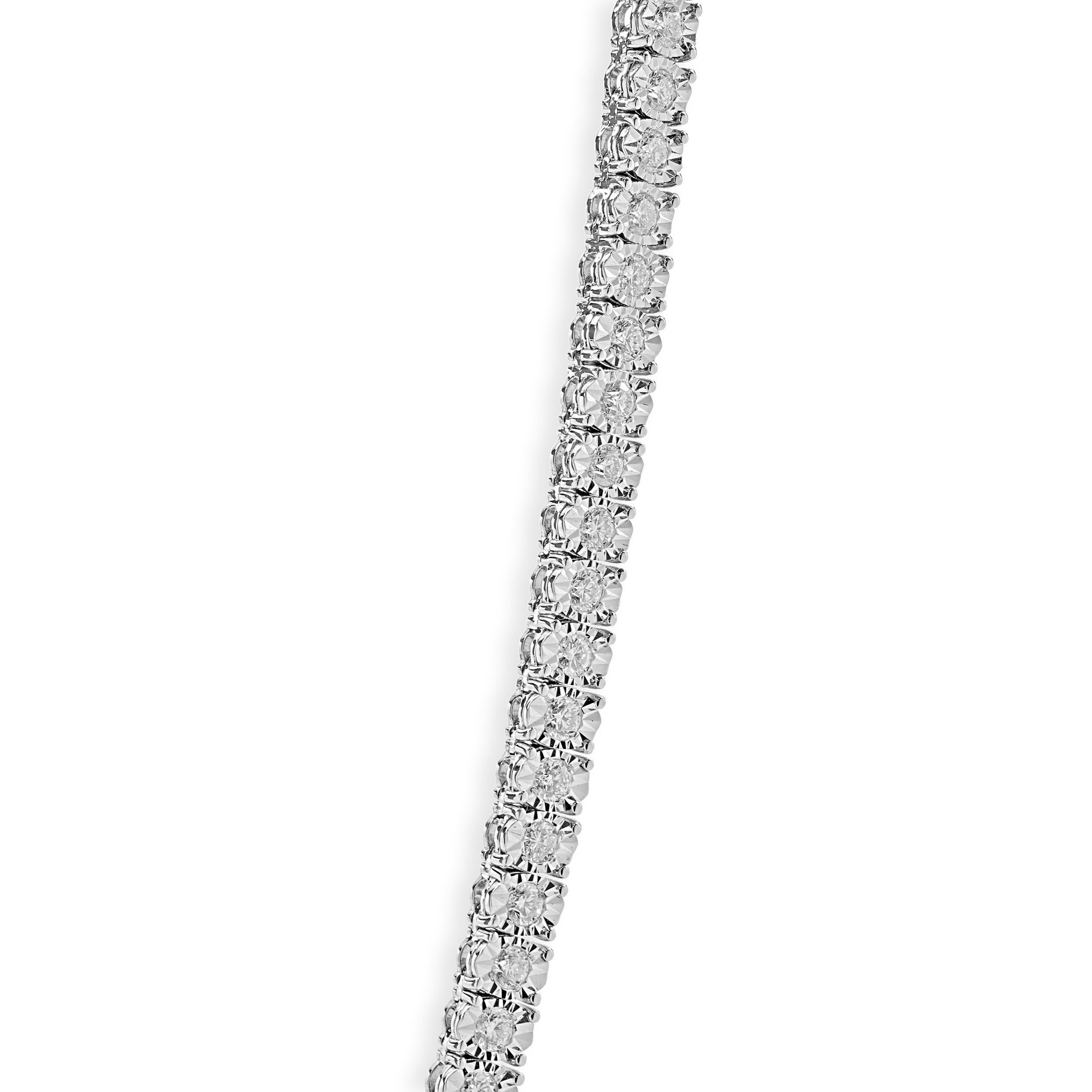 Designer: custom
Material: 14K white gold
Diamonds: 231 round brilliant cut = 16.76cttw
Color: G
Clarity: VS2-SI1
Dimensions: necklace measures 32-inches in length
Weight: 51.50 grams