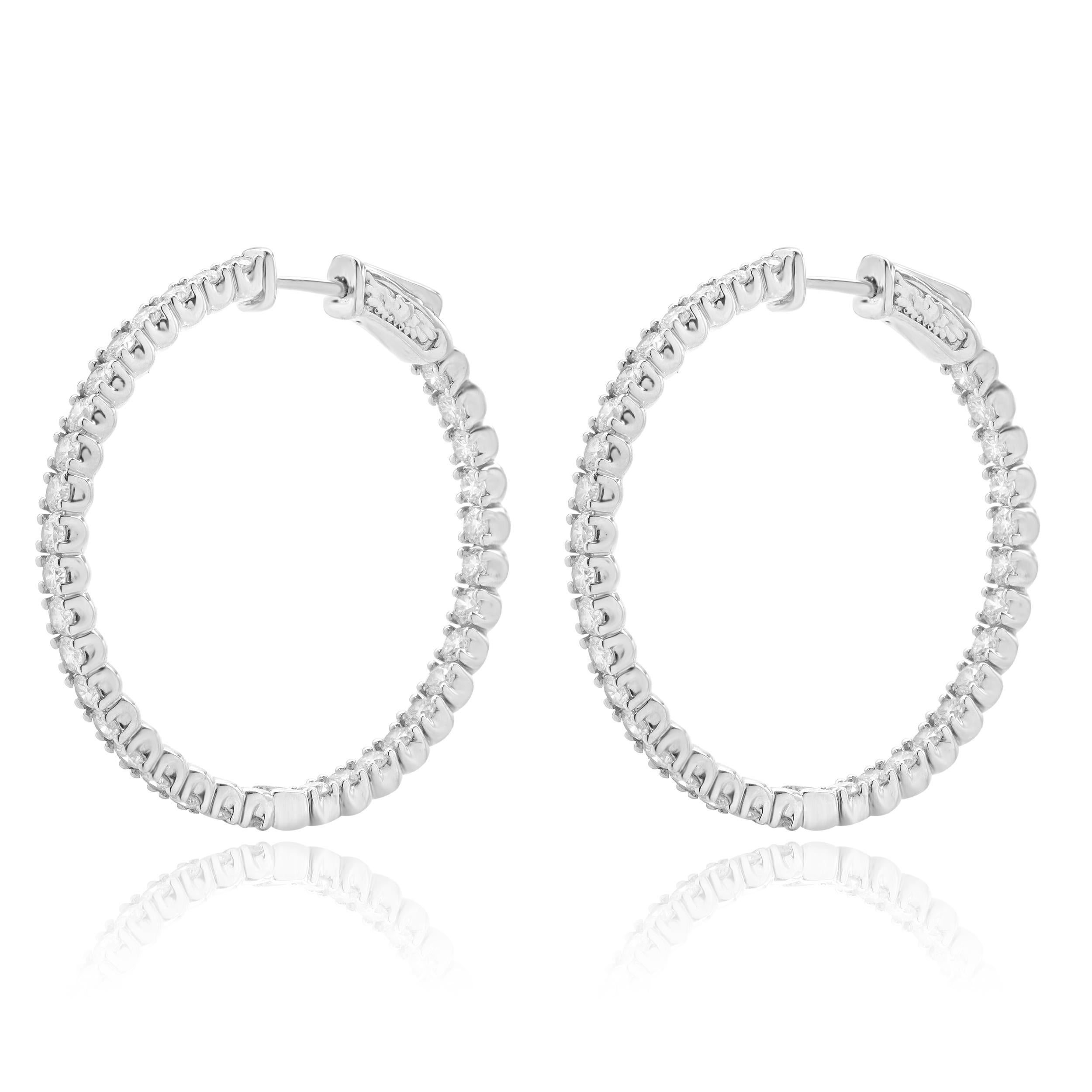 Designer: custom
Material: 14K white gold
Diamond: round brilliant cut =3.40cttw
Color: H
Clarity: VS2
Dimensions: earrings measures 35mm long
Weight: 10.00 grams
