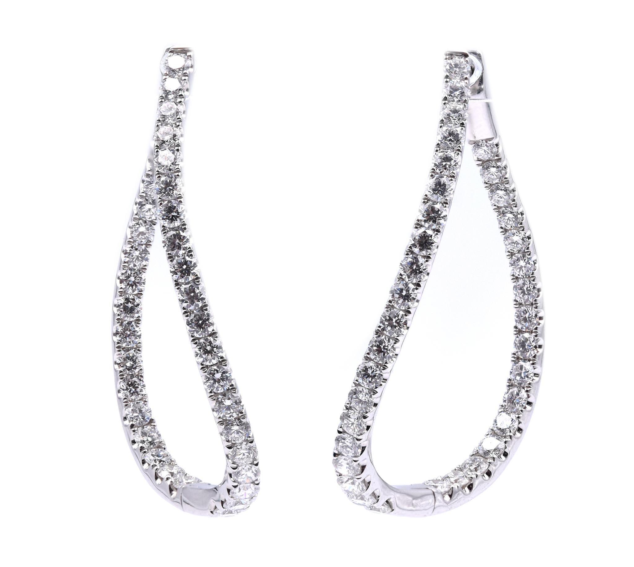 Designer: custom
Material: 14K white gold
Diamonds: 72 round cut = 3.49cttw
Color: G
Clarity: VS1
Dimensions: earrings measure 40mm long
Weight: 10.29 grams
