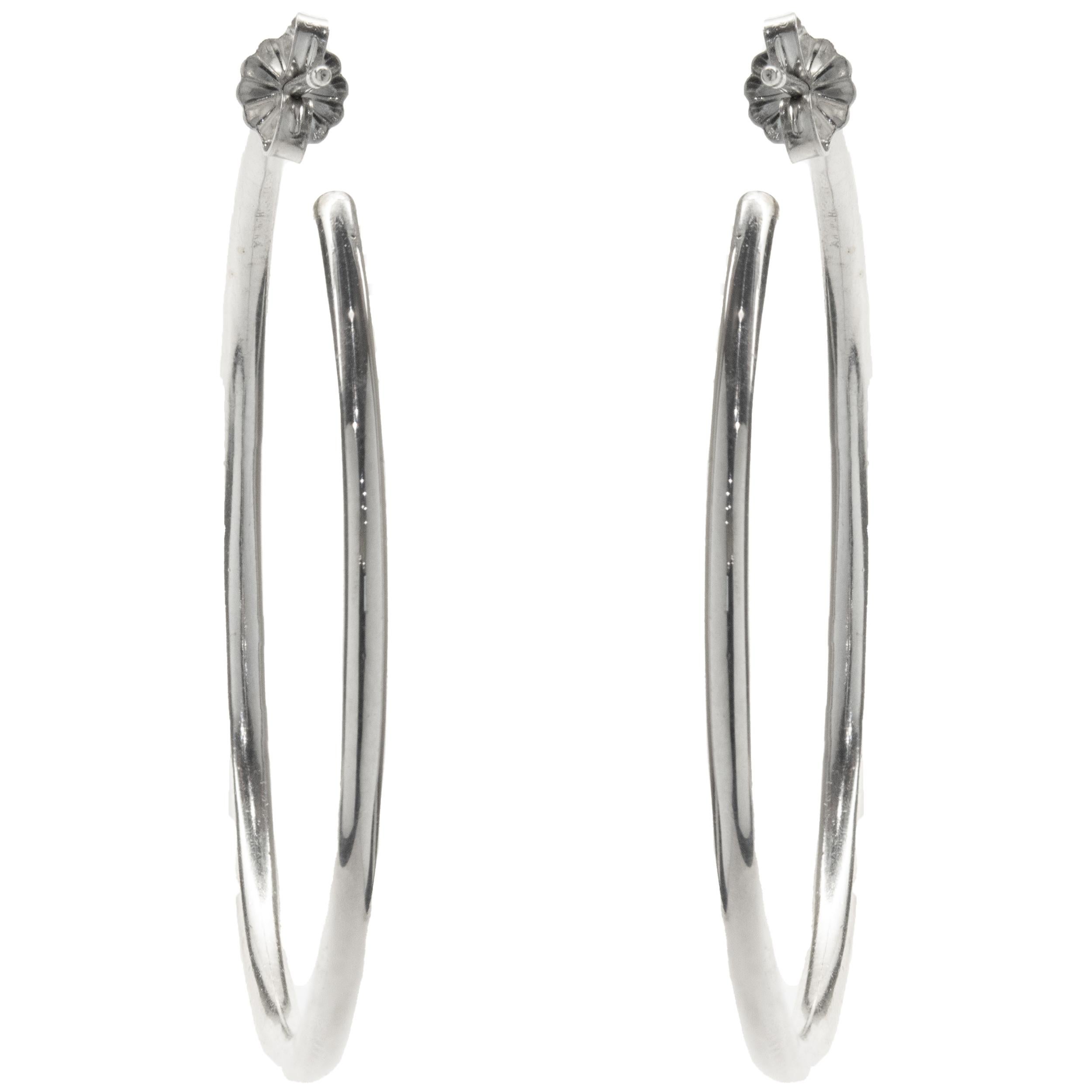 Designer: custom
Material: 14K white gold
Diamond: 124 round brilliant cut = 1.75cttw
Color: G
Clarity: SI1
Dimensions: earrings measure 46mm in length
Fastenings: post with friction backs
Weight: 13.47 grams
