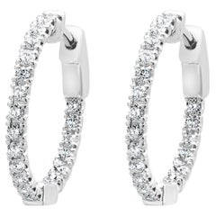 Pendientes de aro con interior y exterior de diamantes en oro blanco de 14 quilates