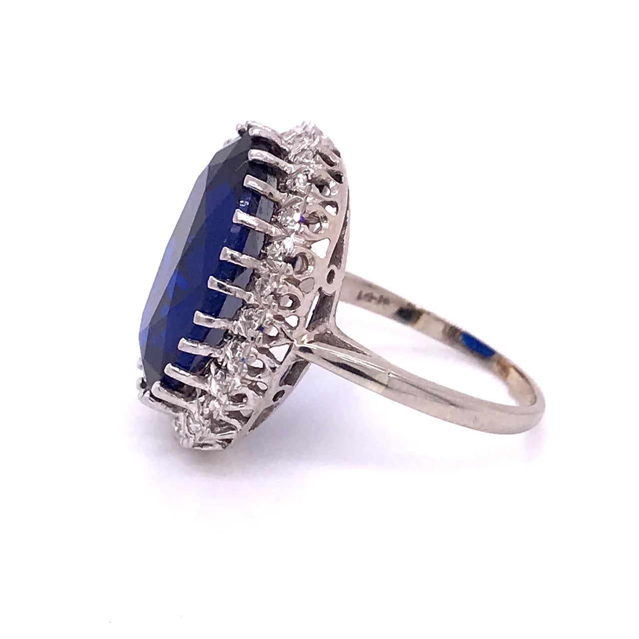 Women's 14 Karat White Gold, Diamond, and Large Blue Topaz Cocktail Ring For Sale