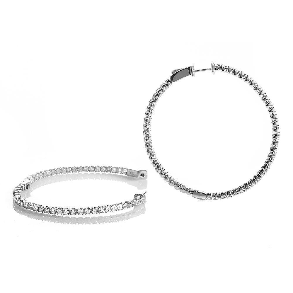 This pair of hoop earrings are gorgeous and lovely; perfect for a very feminine woman. They are made of 14K white gold and are set with ~3.35ct of diamonds.


