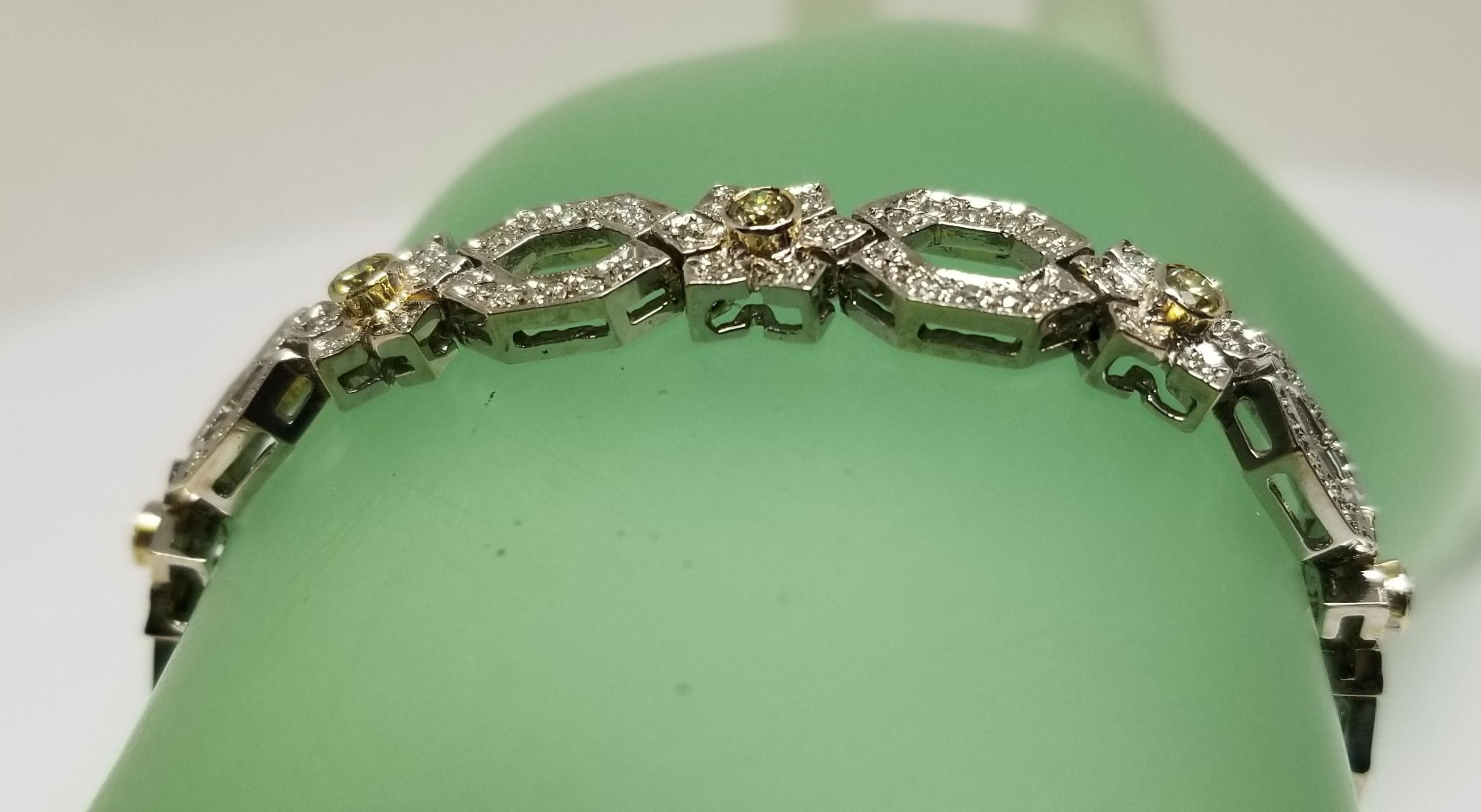 Art Deco 14 Karat White Gold Diamond Link Bracelet with Natural Yellow Diamonds For Sale