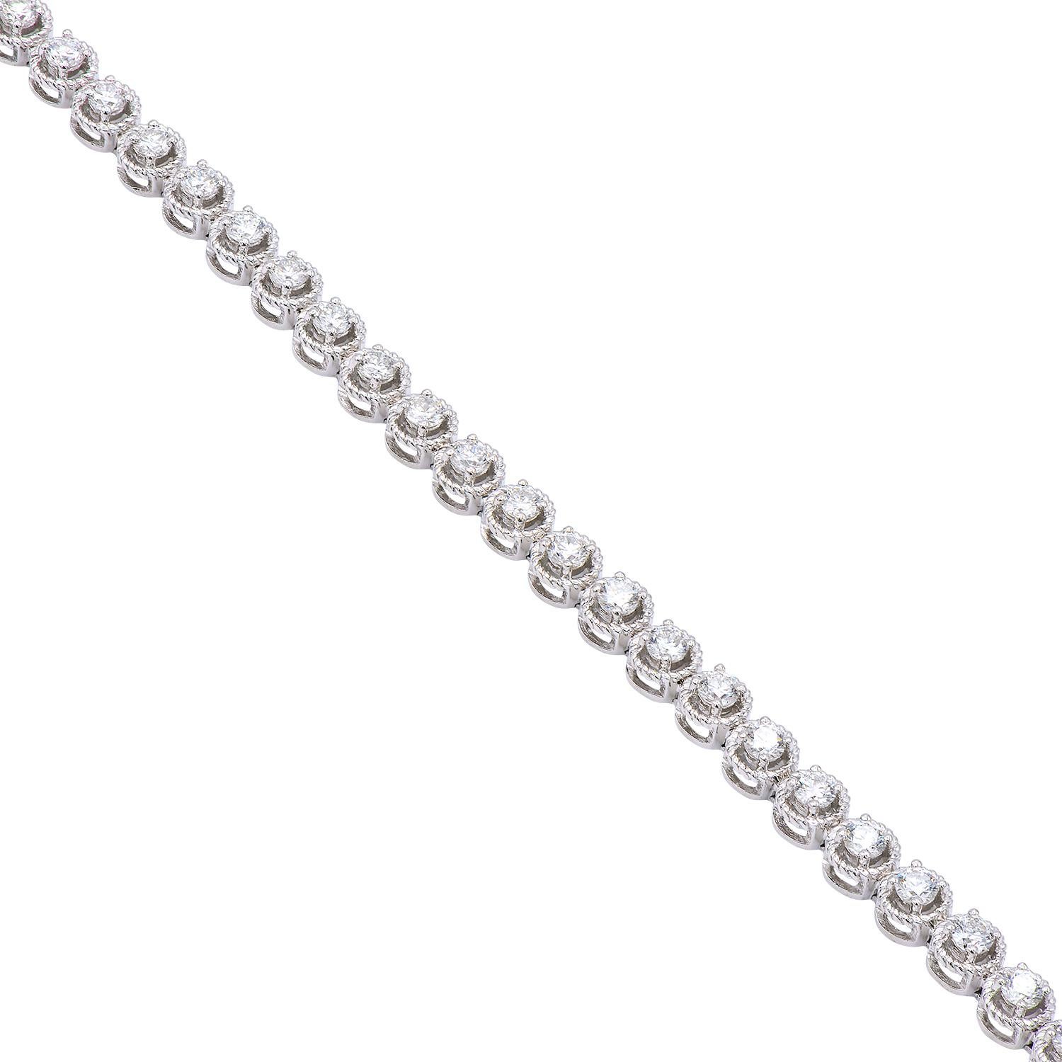 This 14 karat white gold bracelet uses a millgrain technique to add special detail to each of the 72 round SI, H color diamonds. The 3.9 grams of gold expertly circle and enhance the 1.00 carats of diamonds to create a special and beautiful