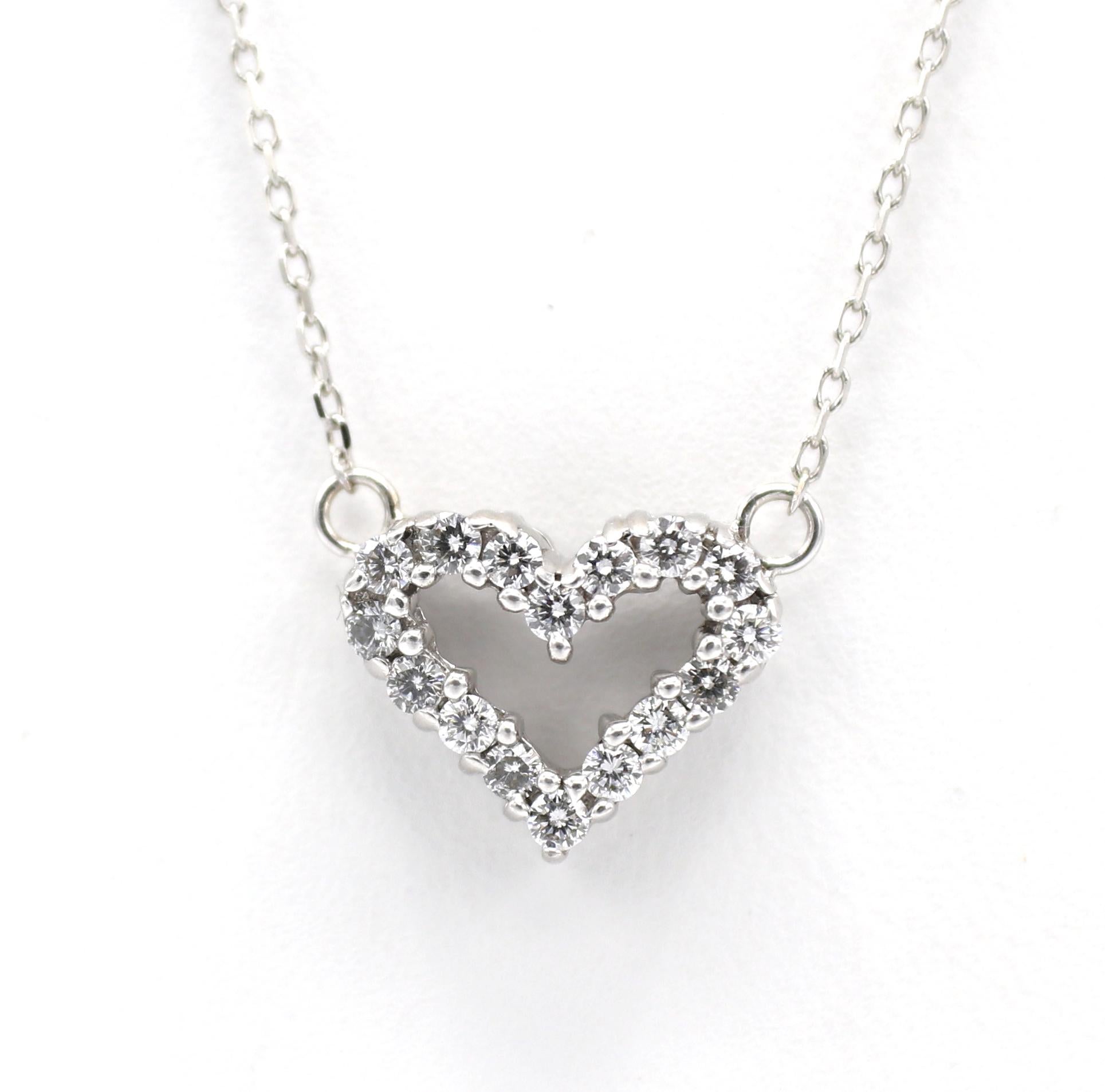 14 Karat White Gold Natural Diamond Open Heart Pendant Drop Necklace 
Metal: 14k white gold
Weight: 2.40 grams
Diamonds: Approx. .16 CTW H-I VS round natural diamonds
Dimensions: 12 x 10mm
Chain length: 18 inches