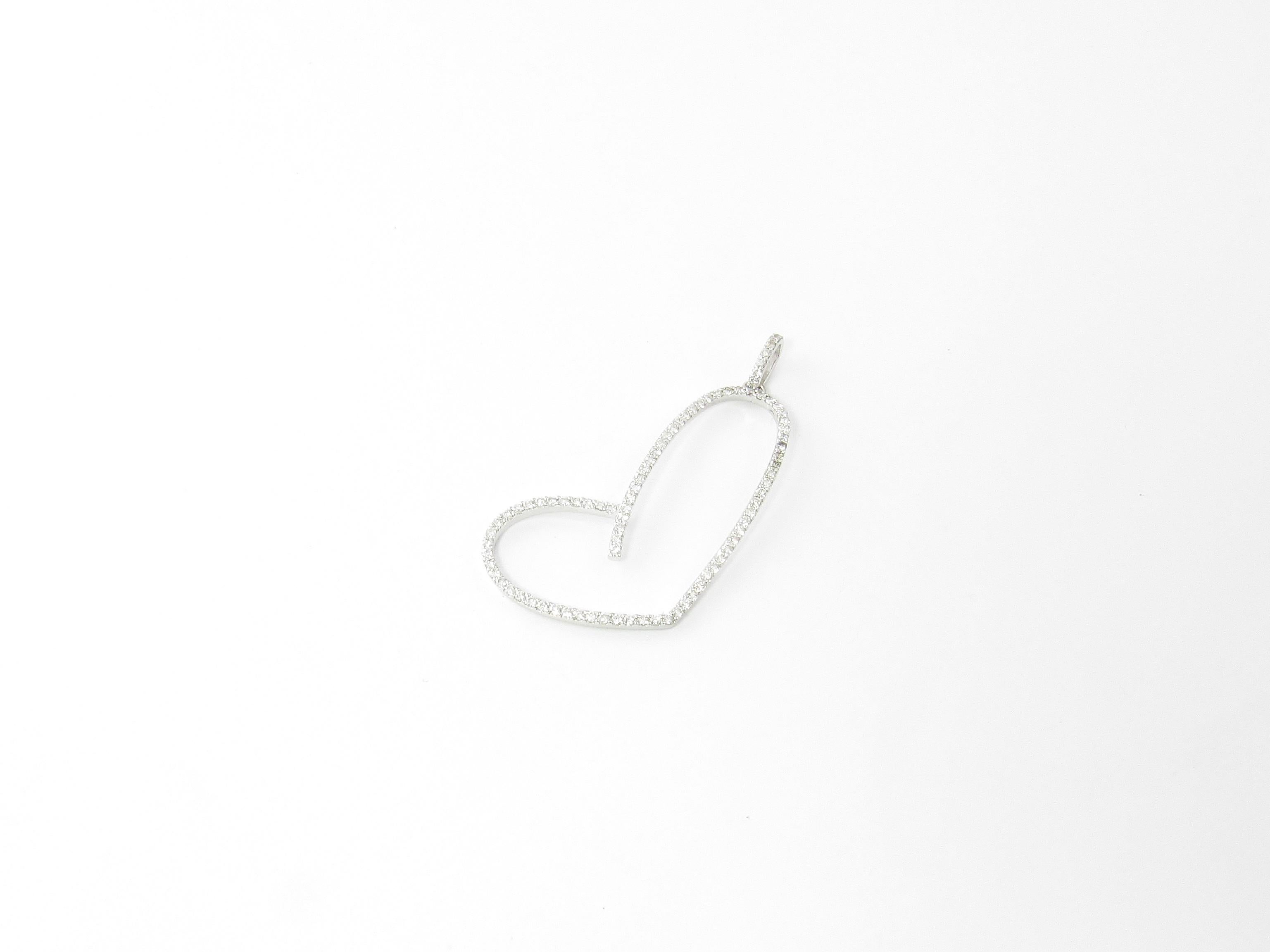 Vintage 14 Karat White Gold Diamond Heart Pendant

This stunning open heart pendant features 80 round brilliant cut diamond set in classic 14K white gold.

Approximate total diamond weight: .90 ct.

Diamond color: G

Diamond clarity: VS2

Size: 44