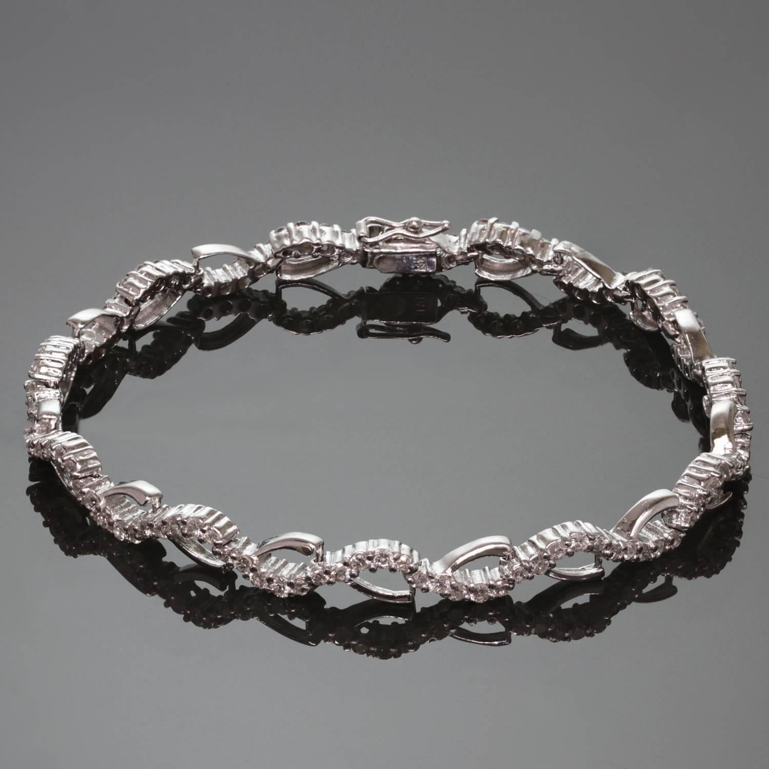 A classic modern tennis bracelet featuring 14k white gold wavy open links set with sparkling round brilliant-cut diamonds of an estimated 3.54 carats. A timeless design for everyday elegance. Measurements: 0.23