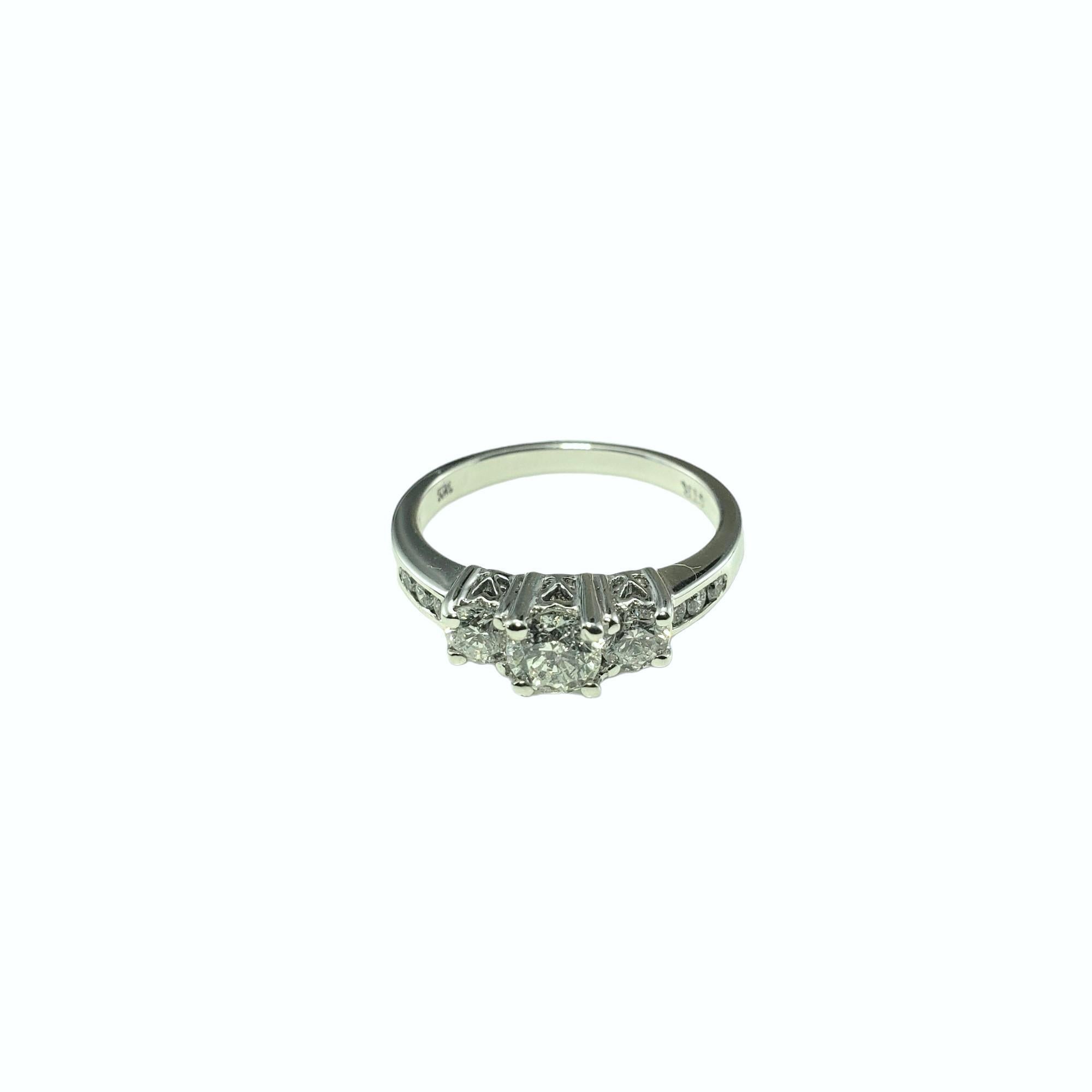14 Karat White Gold Diamond Past, Present and Future Ring Size 7-

This sparkling ring features nine round brilliant cut diamonds (center: .50 ct.) set in beautifully detailed 14K white gold.  Width:  5 mm.  Shank:  2.1 mm.

Approximate total