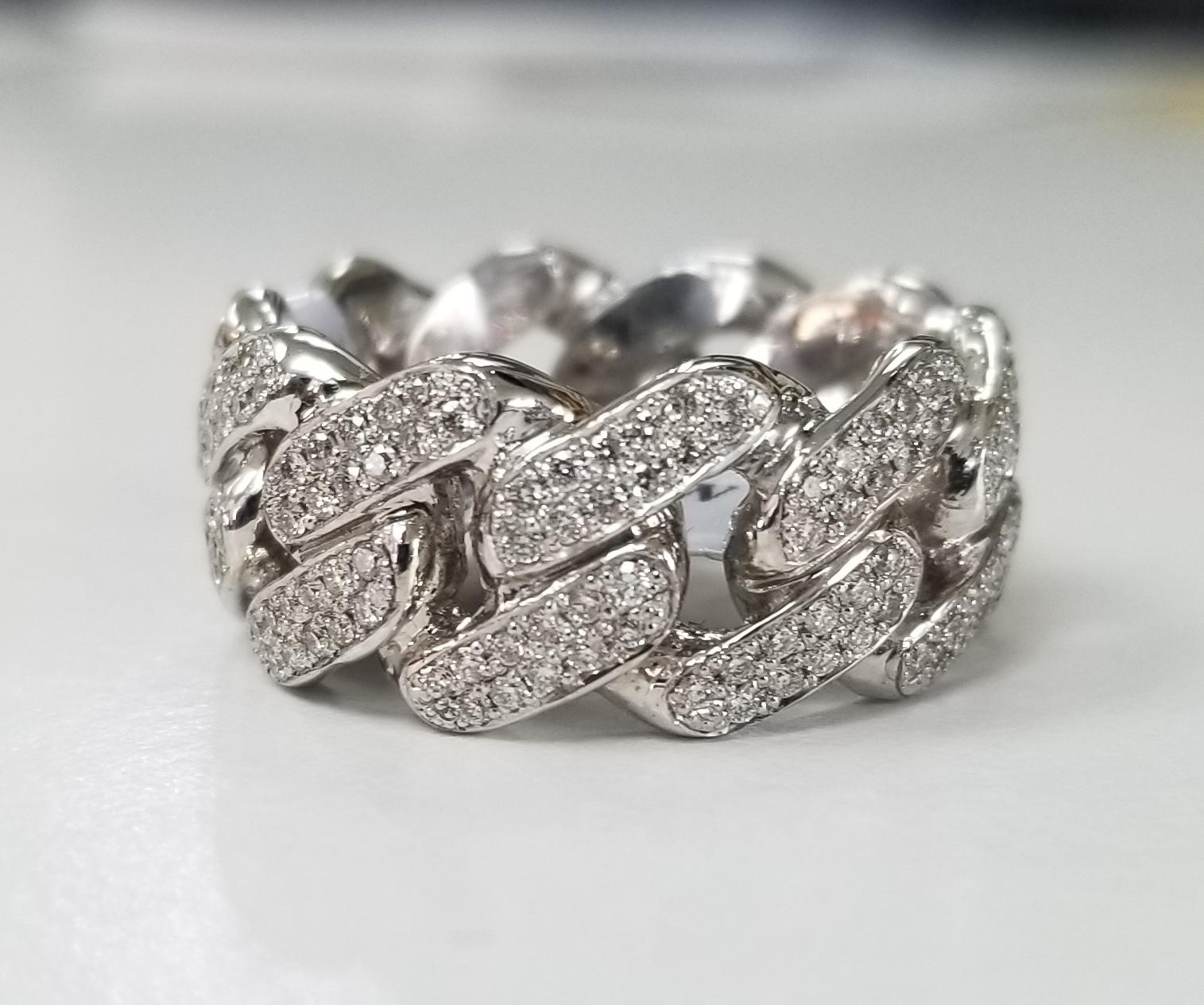14 karat white gold diamond pave' link ring, containing 220 round full cut diamonds of very fine quality weighing 1.26cts. ring size is 9 and is 9mm wide. The ring is a eternity ring, meaning diamonds all around.