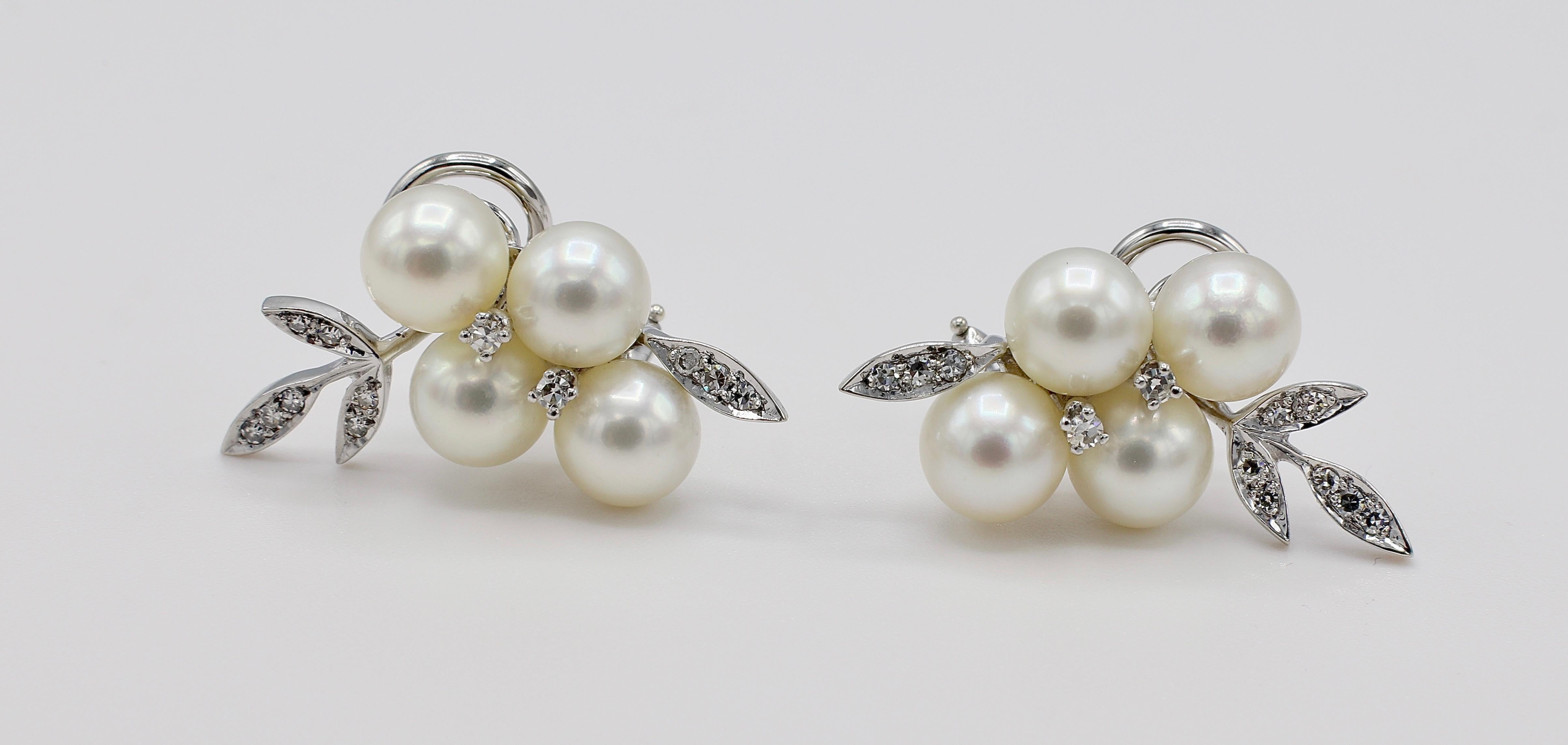 14 Karat White Gold Diamond & Pearl Cluster Leaf Earrings 
Metal: 14k white gold
Weight: 9.45 grams
Diamonds: 24 single cut diamonds, approx. .30 CTW G VS
Pearls: 7mm white color with a creamy luster 
Length: 29mm
Width: 15mm
