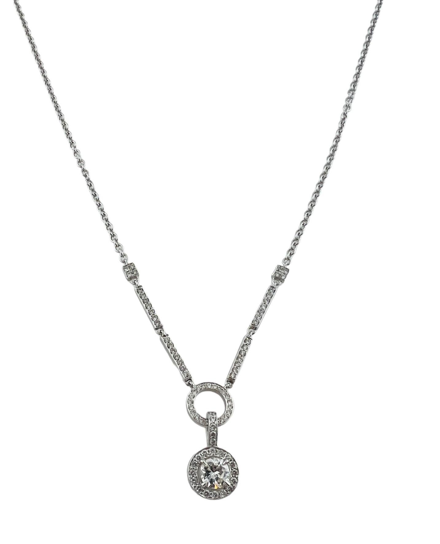 This sparkling pendant necklace features 79 round brilliant cut diamonds (center: .60 ct.) set in classic 14K white gold.

Total diamond weight:   .97 ct.

Diamond color:  G-H

Diamond clarity:  SI1-I1

Size:  17 inches (necklace)

21 mm x 9 mm