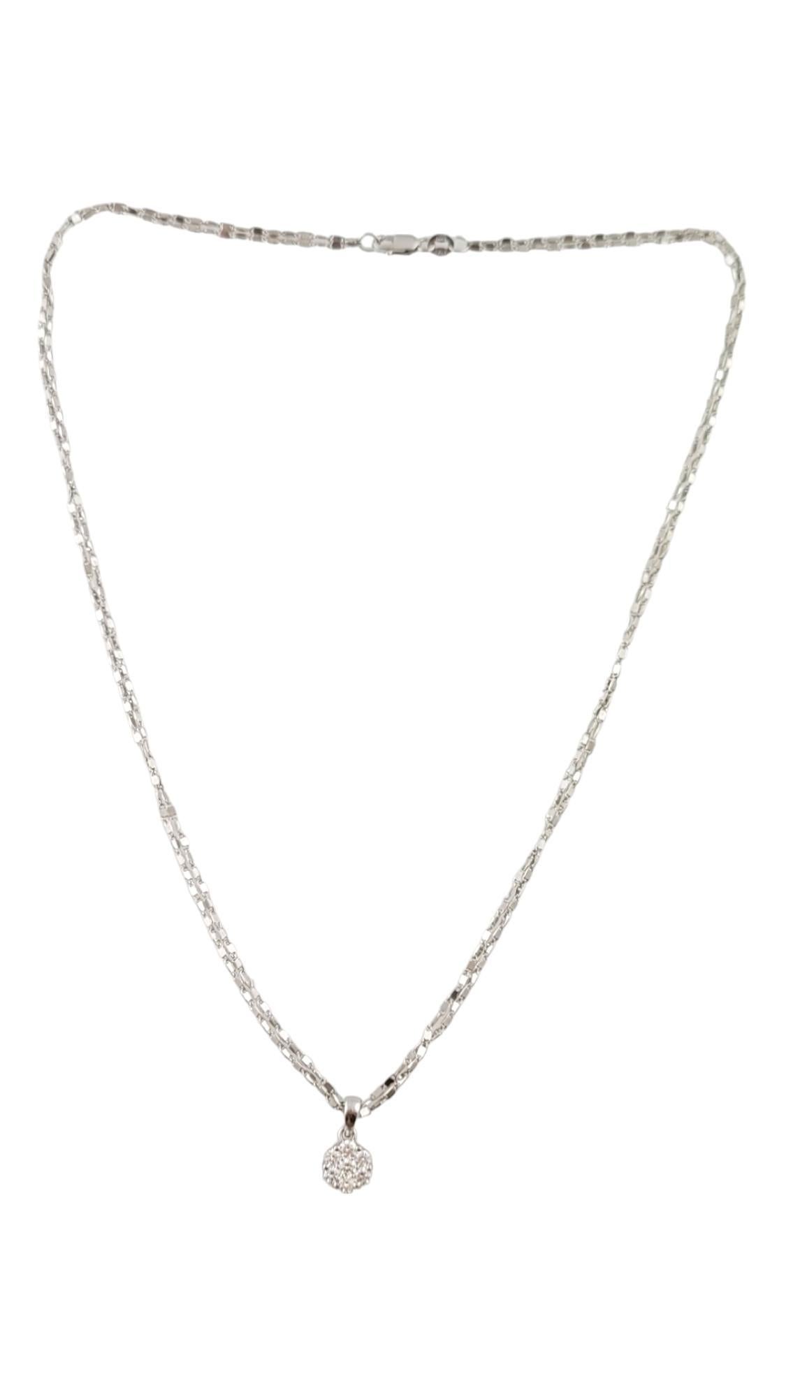 14 Karat White Gold Diamond Pendant Necklace-

This sparkling pendant features seven round brilliant cut diamonds* suspended from a double chain 14K white gold necklace.

*Small chip noted to one stone not visible to naked eye.

Approximate total