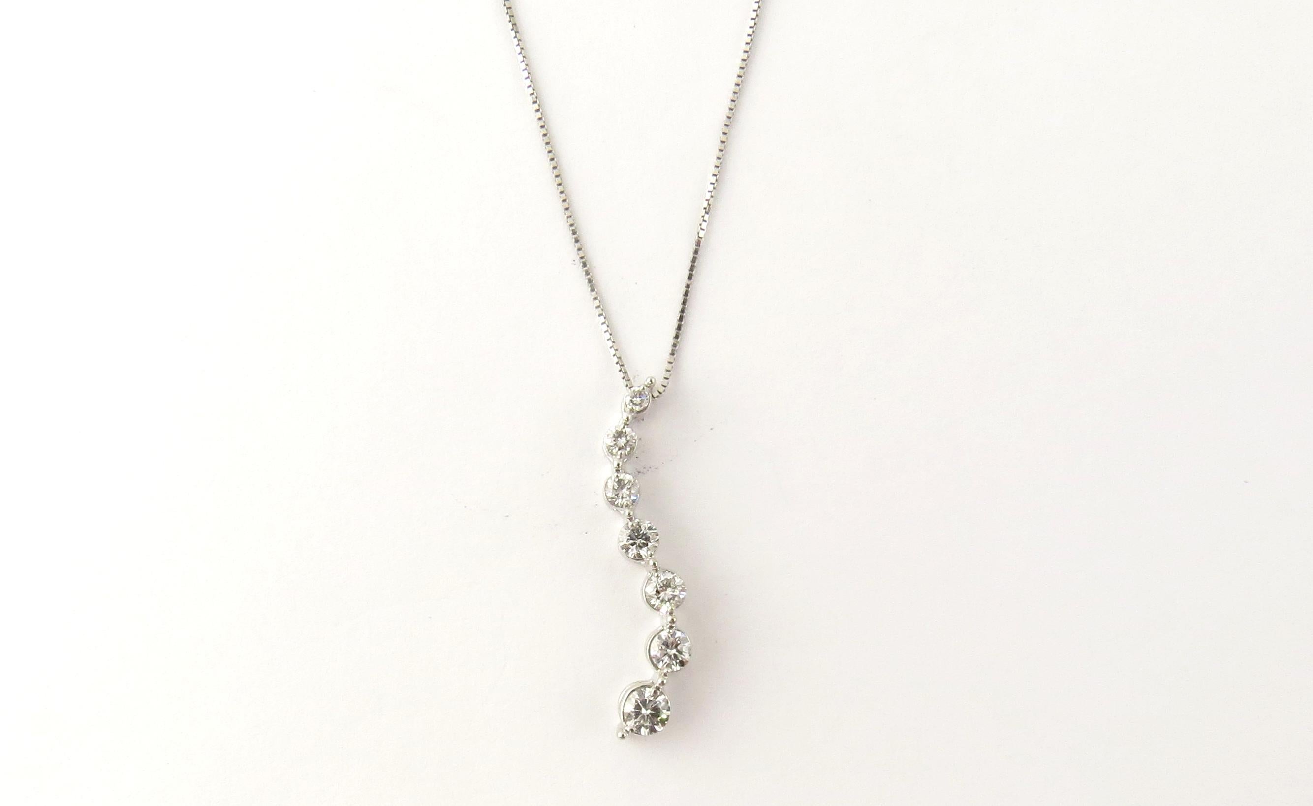 Vintage 14 Karat White Gold Diamond Pendant Necklace

This sparkling pendant features seven round brilliant cut diamonds suspended from a classic 14K white gold necklace.

Approximate total diamond weight: .33 ct.

Diamond color: H-I

Diamond