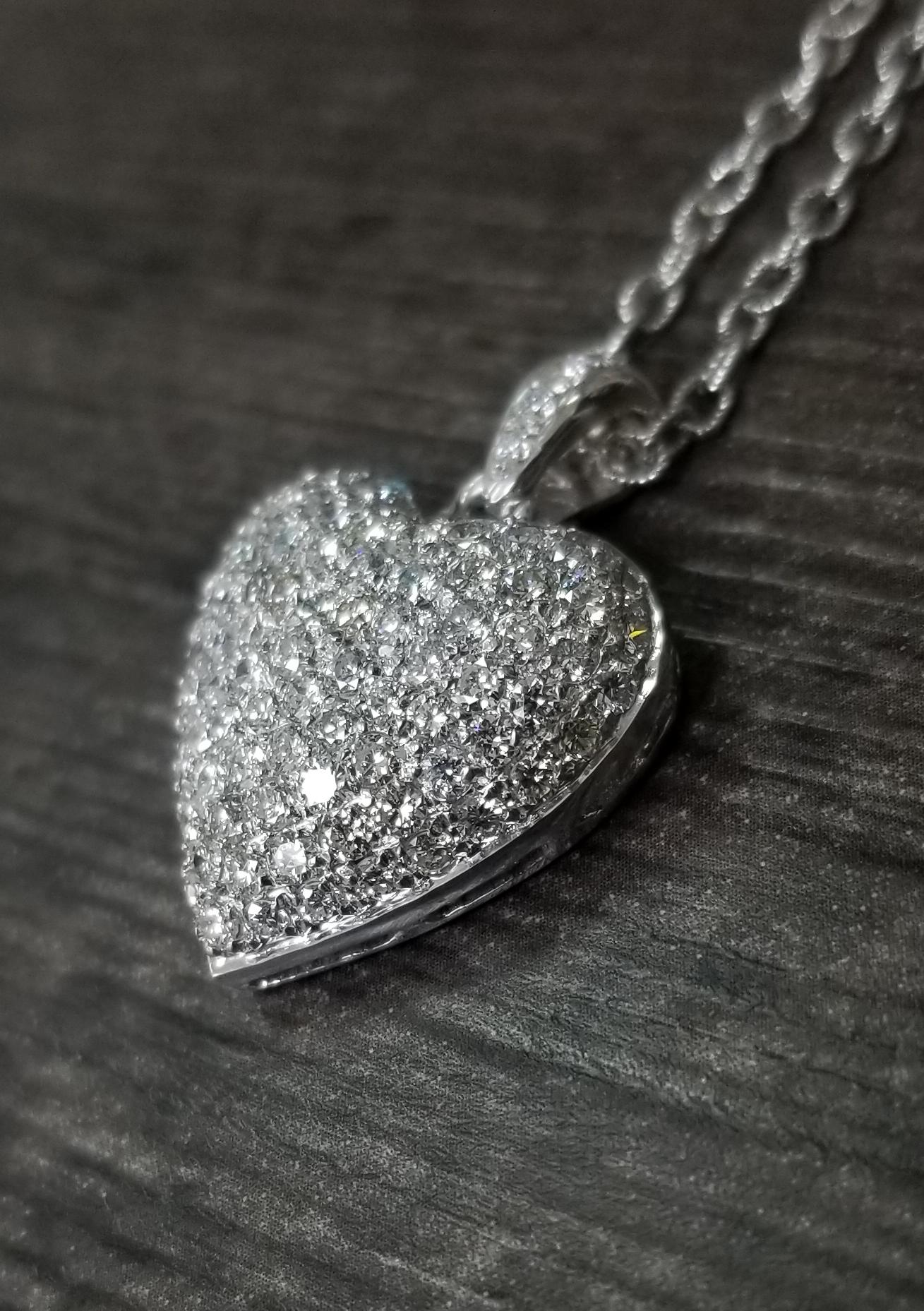 14k white gold diamond puffed heart, containing 104 round full cut diamonds of very fine quality weighing 2.85cts. on a 16 inch beaded link chain.