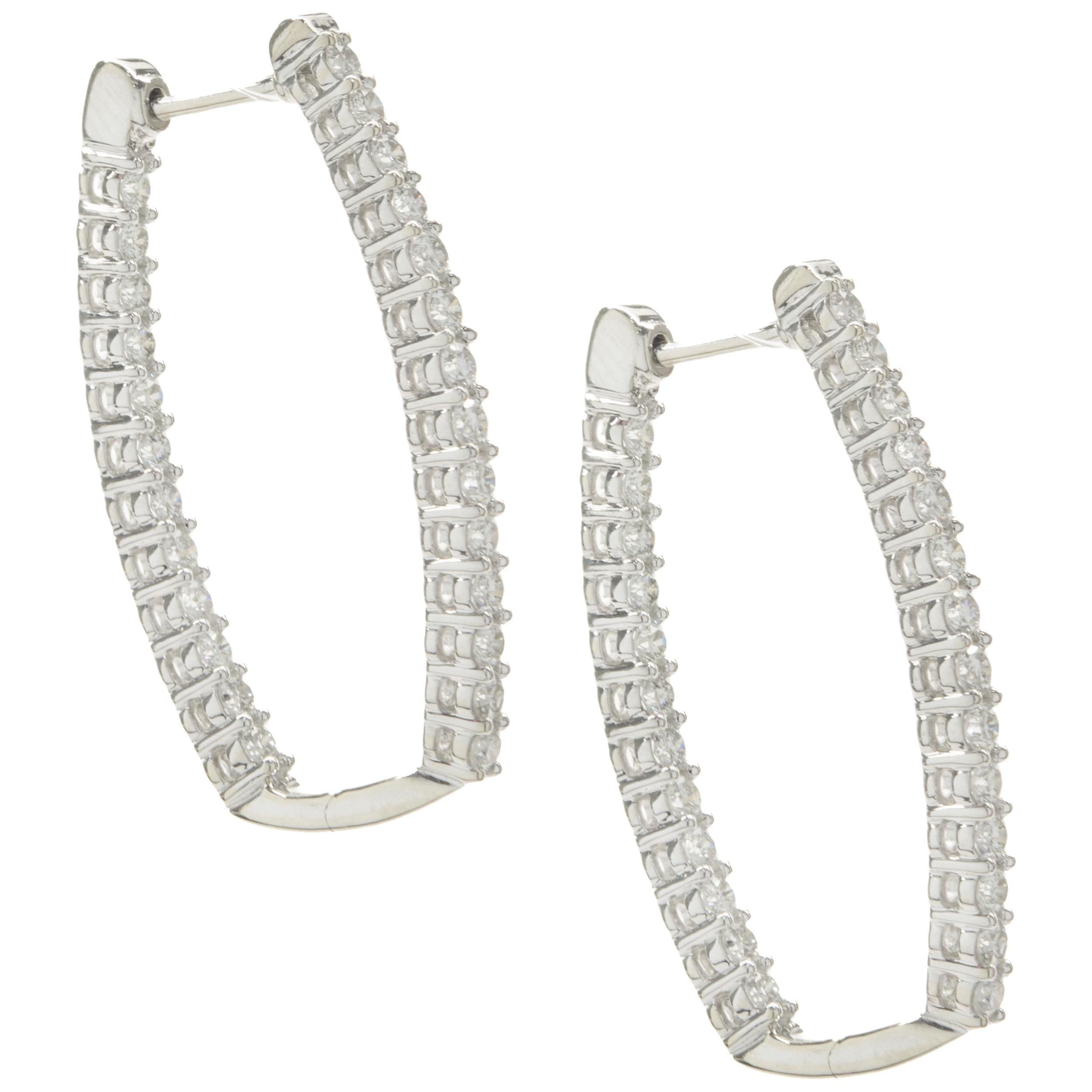Designer: custom design
Material: 14K white gold
Diamonds: 52 round brilliant cut= 0.84cttw
Color: H
Clarity: SI1
Dimensions: earrings measure 34mm long
Weight: 7.07 grams