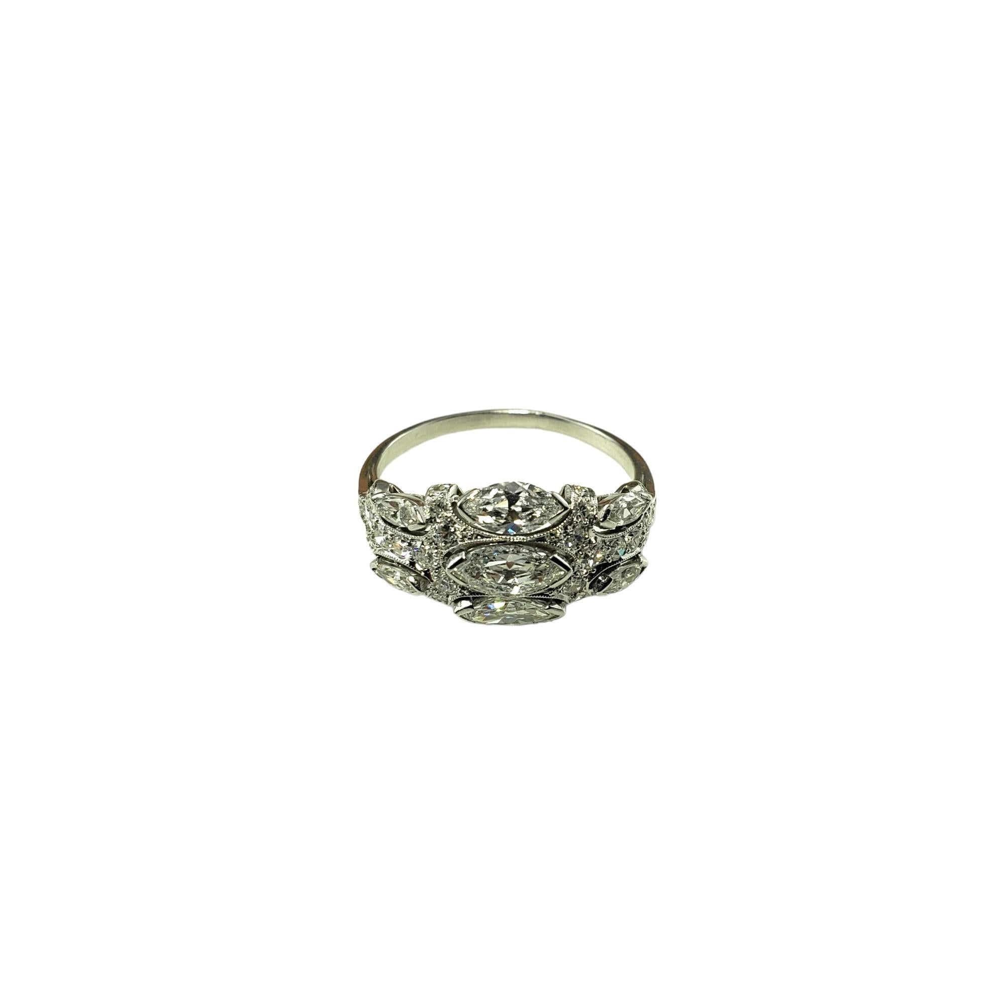 Vintage 14K White Gold Diamond Ring Size 8 JAGi Certified-

This sparkling ring features seven marquise diamonds and 33 single cut diamonds set classic 14K white gold.  Width:  10 mm.  Shank: 1.5 mm.

Total diamond weight:  1.19 ct.

Diamond