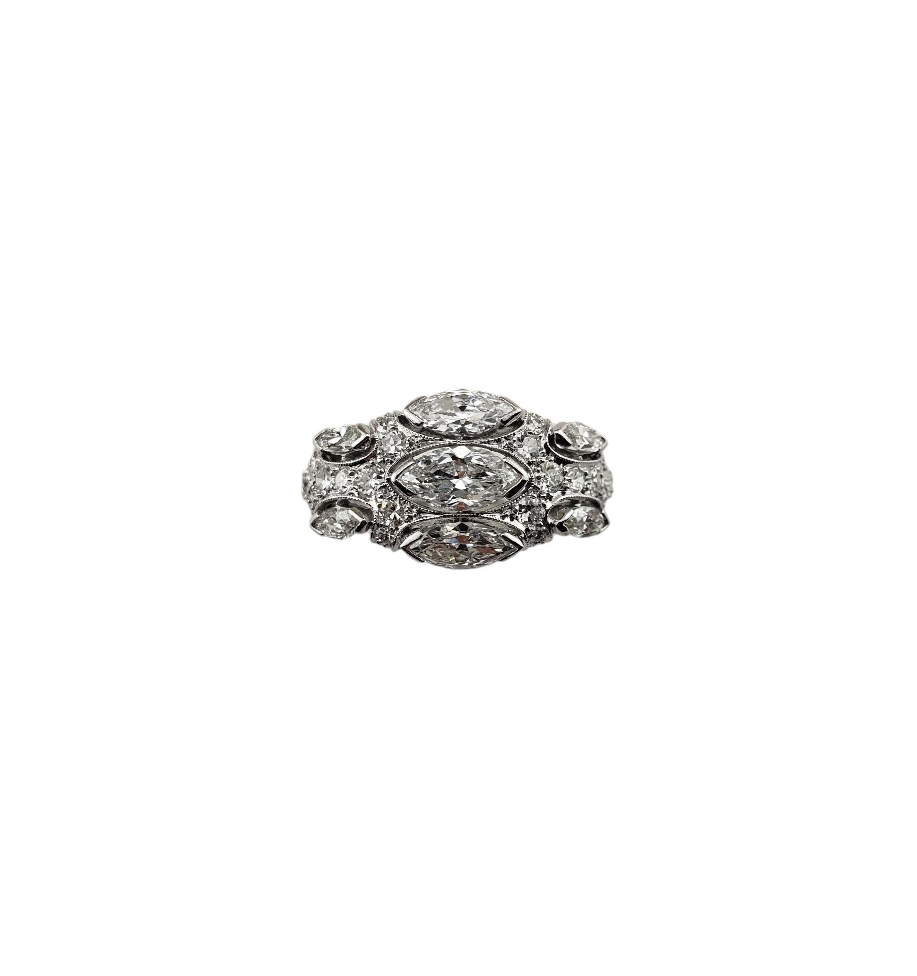 Vintage 14K White Gold Diamond Ring Size 8 JAGi Certified-

This sparkling ring features seven marquise diamonds and 33 single cut diamonds set classic 14K white gold.

Width: 10 mm. Shank: 1.5 mm.

Total diamond weight: 1.19 ct.

Diamond clarity: