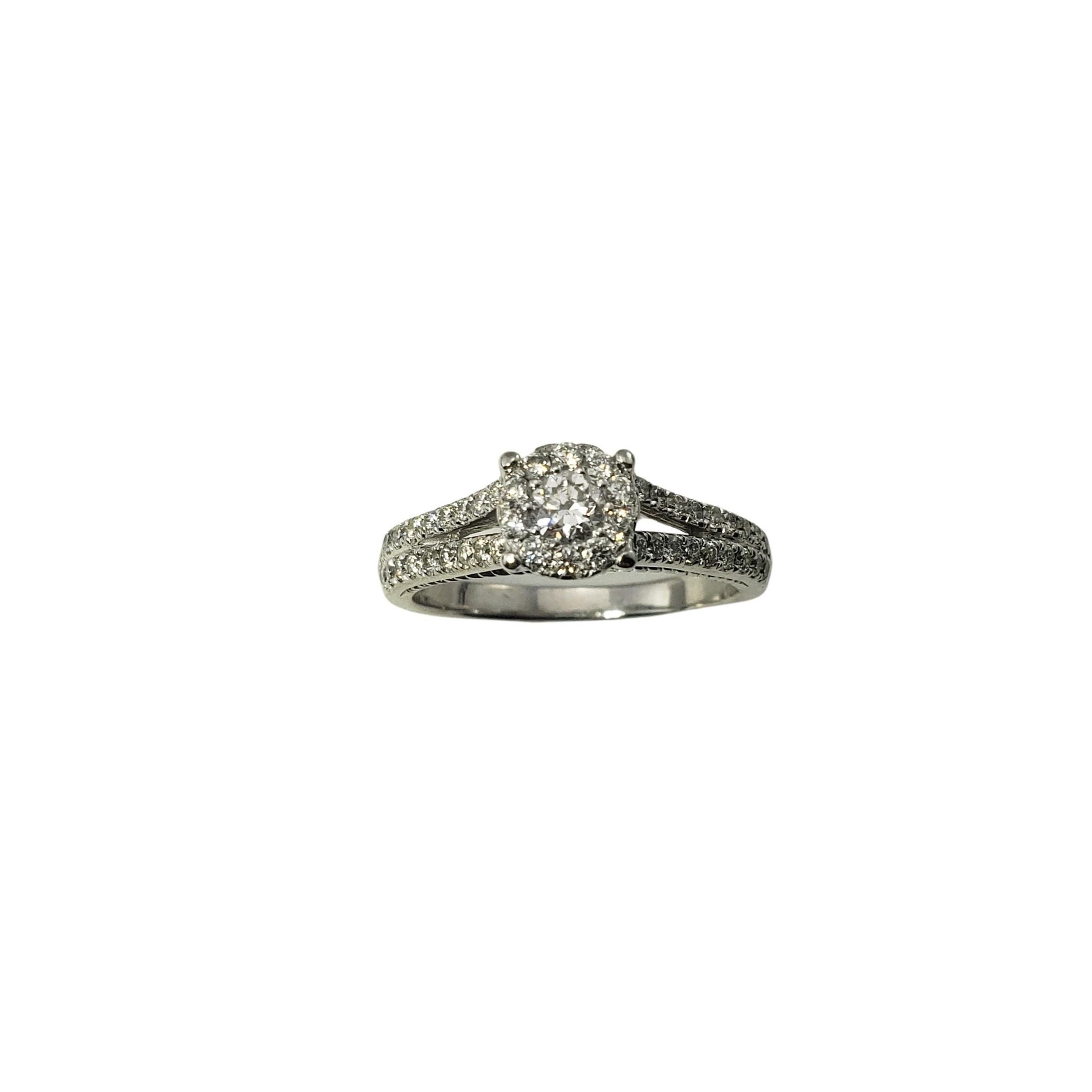 14 Karat White Gold and Diamond Ring Size 9.25-

This sparkling ring features 47 round brilliant cut diamonds (center: .20 ct.) set in beautifully detailed 14K white gold.  
Width:  8 mm.
Shank:  2 mm.

Approximate total diamond weight:  .76