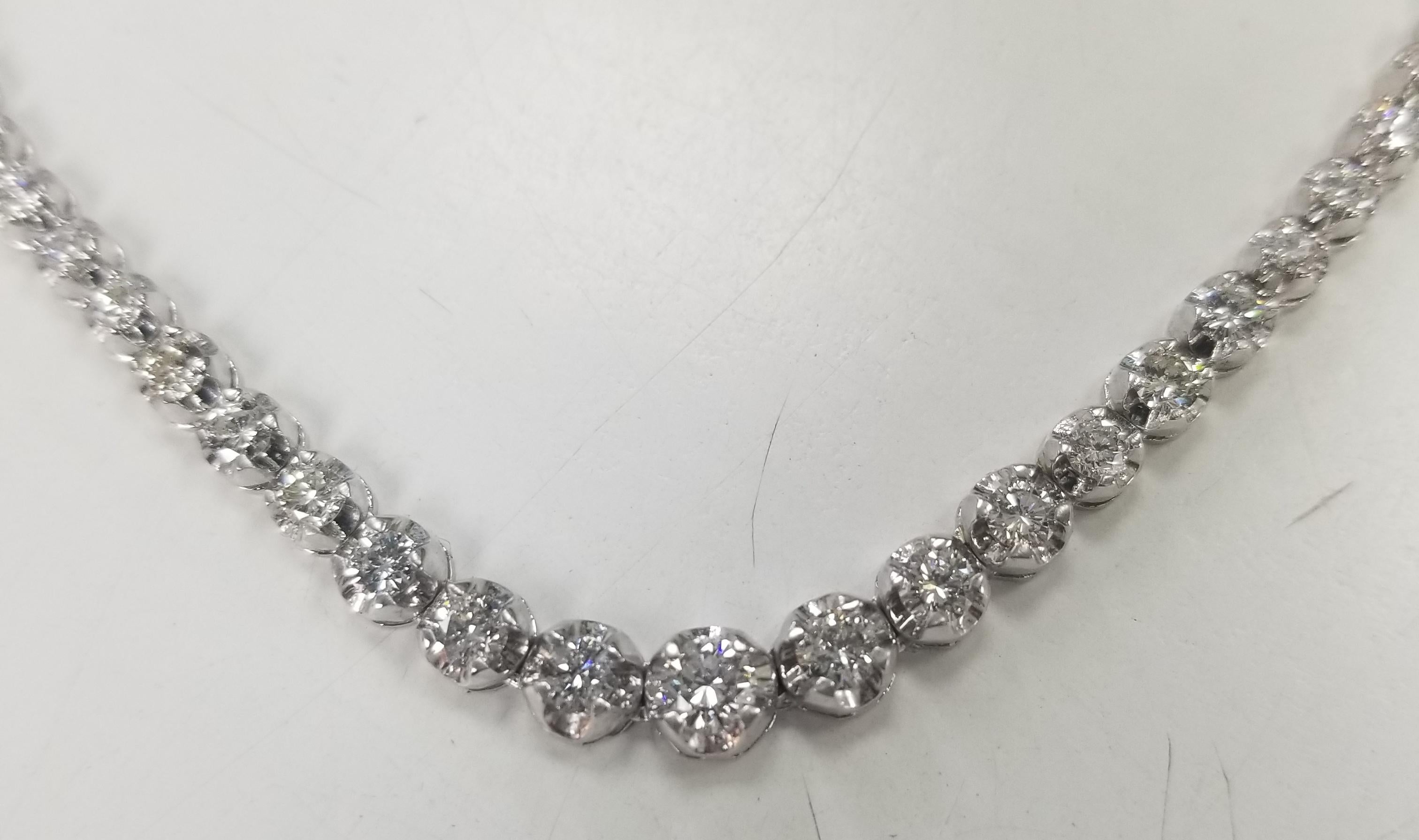 Bring the elegance of your style with this stunning diamond riviera tennis necklace. This piece has 123 pieces of diamonds in 5.02 carat total weight, G color and VS2-SI12 in clarity, crafted in 14k white gold.  
Specifications:
    main stone: