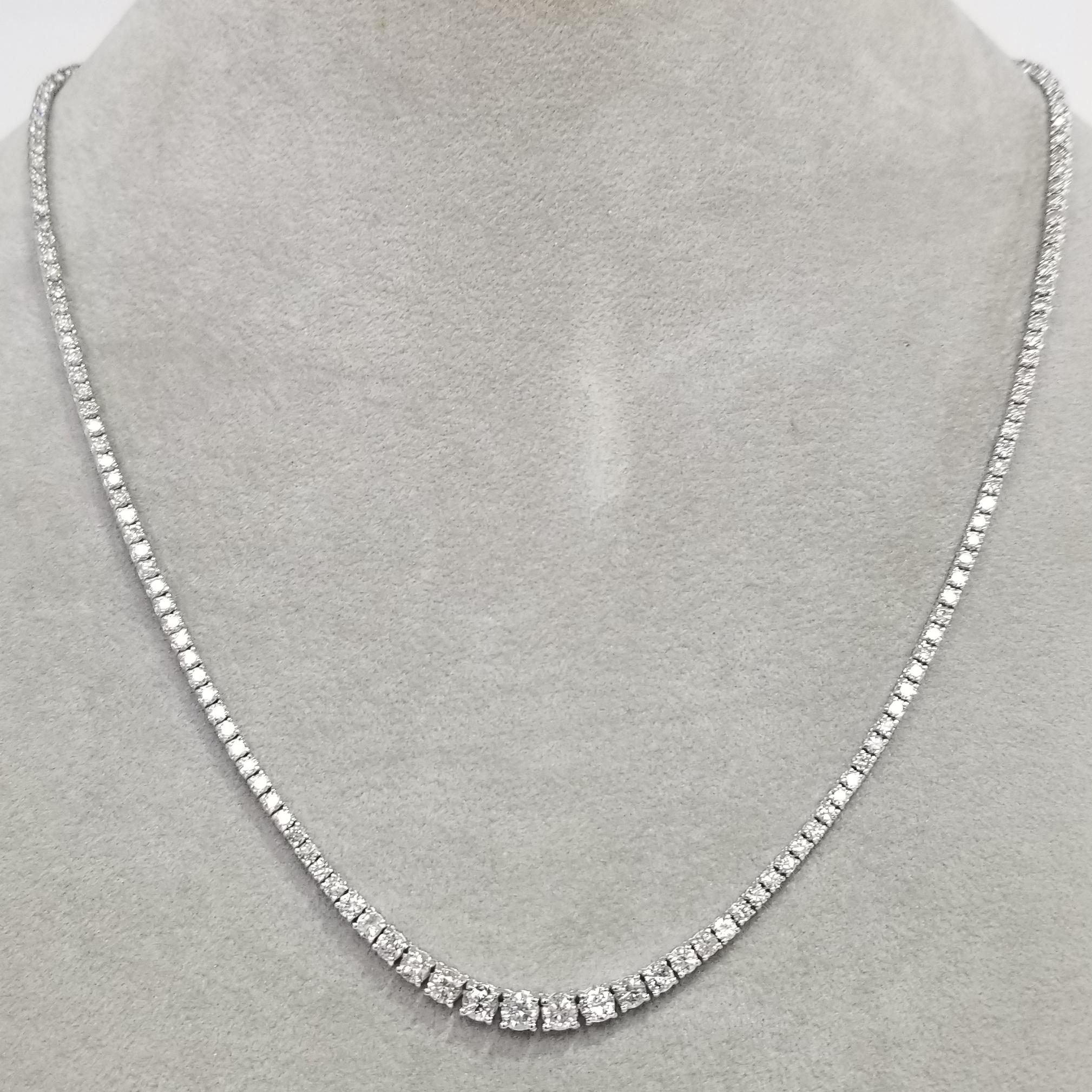 Bring the elegance of your style with this stunning diamond riviera tennis necklace. This piece has 173 pieces of diamonds in 6.57 carat total weight, G color and VS2-SI1 in clarity, crafted in 14k white gold.  
Specifications:
    main stone: ROUND