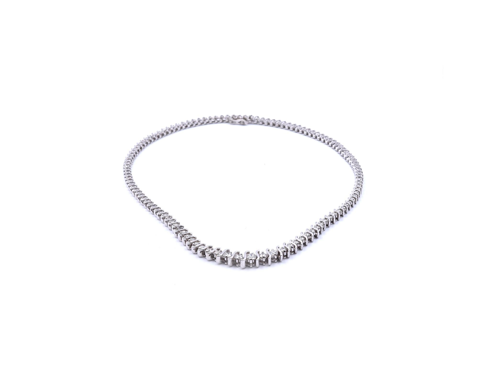 Designer: custom designed
Material: 14k white gold
Diamonds: round brilliant cut = 4.25cttw
Color: G
Clarity: VS-SI1
Dimensions: bracelet measures 7 inches mm wide and is 4.38mm wide
Weight: 34.22 grams