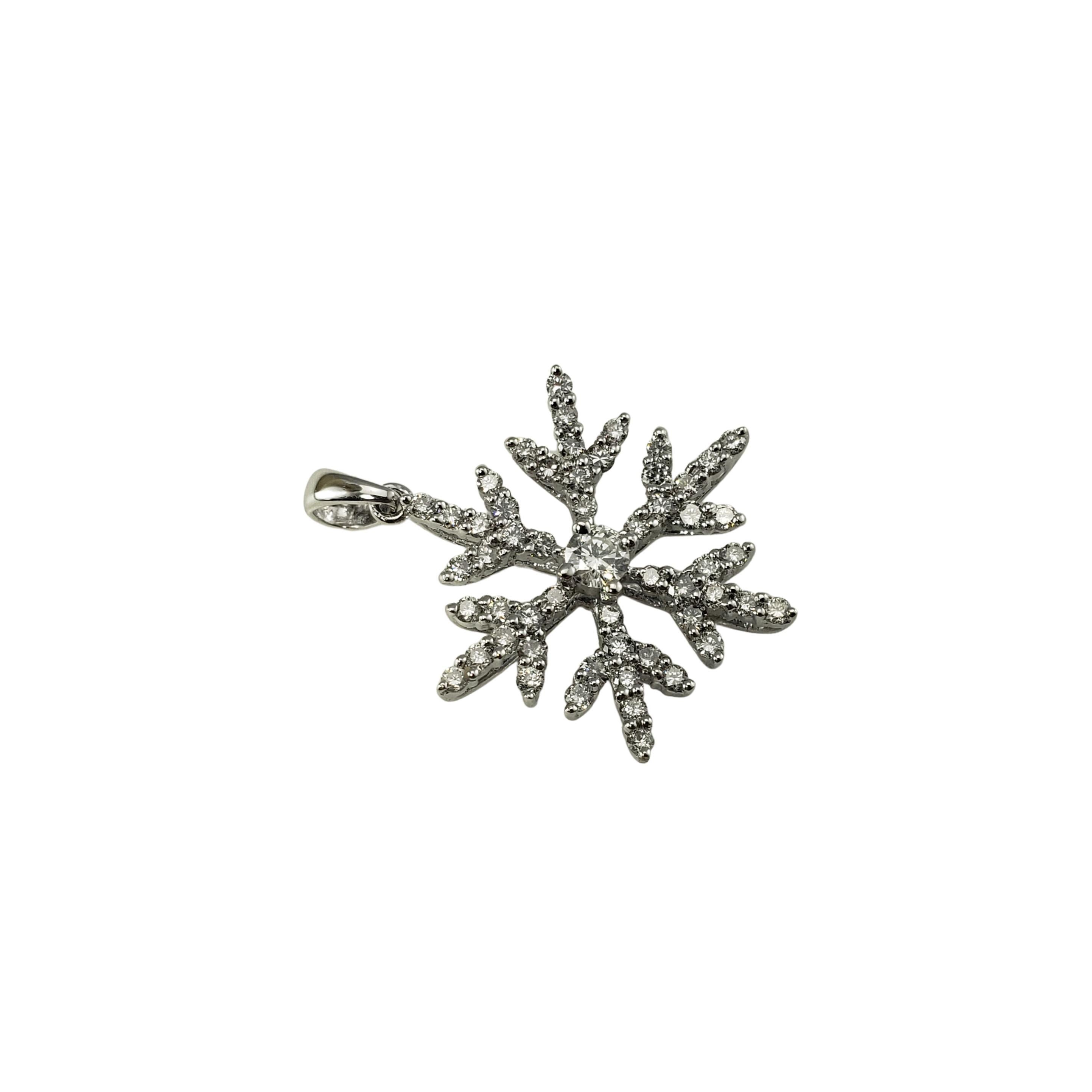14 Karat White Gold Diamond Snowflake Pendant-

This sparkling pendant features 55 round brilliant cut diamonds set in beautifully detailed 14K white gold.  

Approximate total diamond weight:  .62 ct.

Diamond color:  H-I

Diamond clarity: 