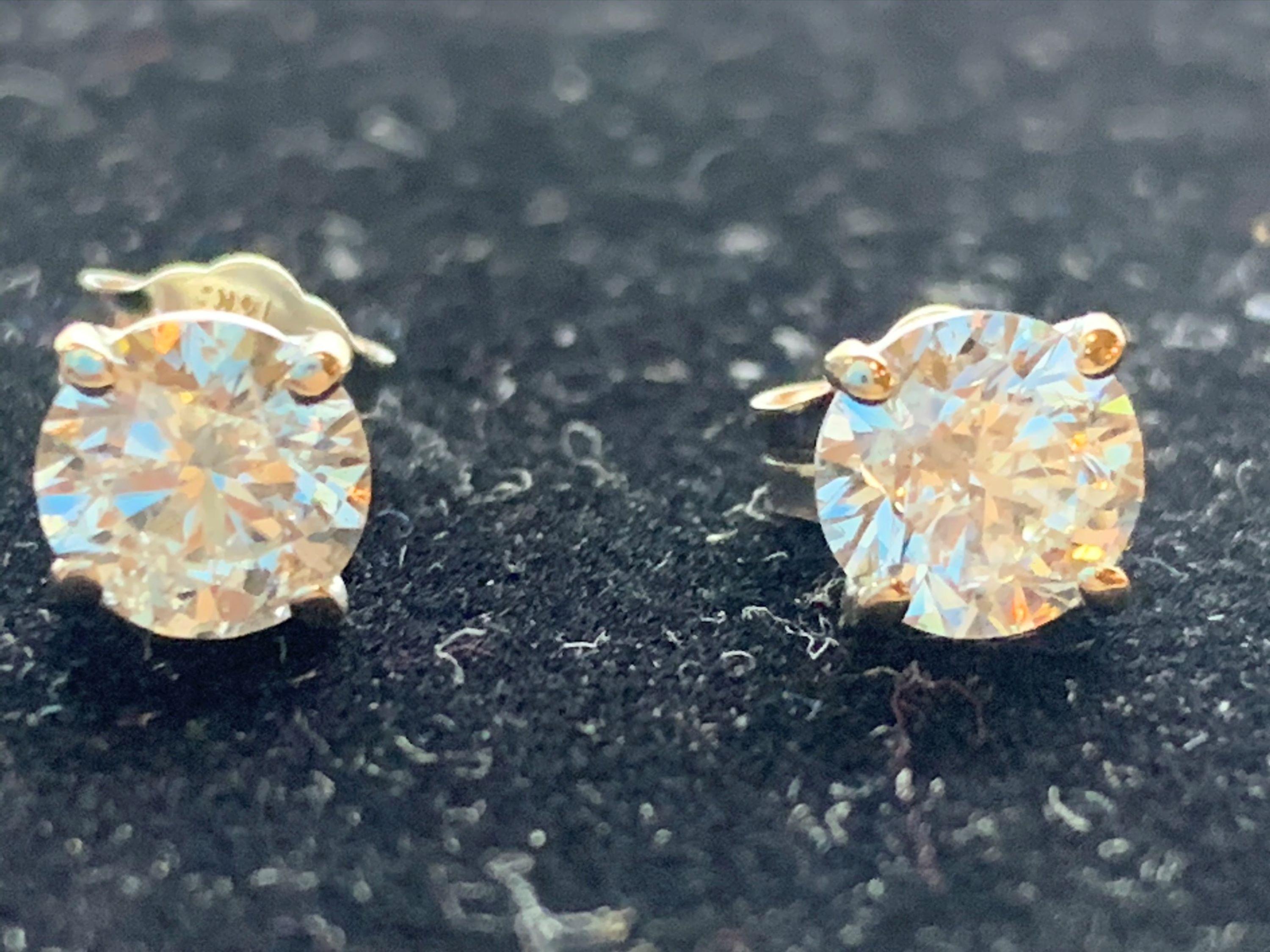 Women's 14 Karat White Gold Diamond Solitaire Earrings For Sale