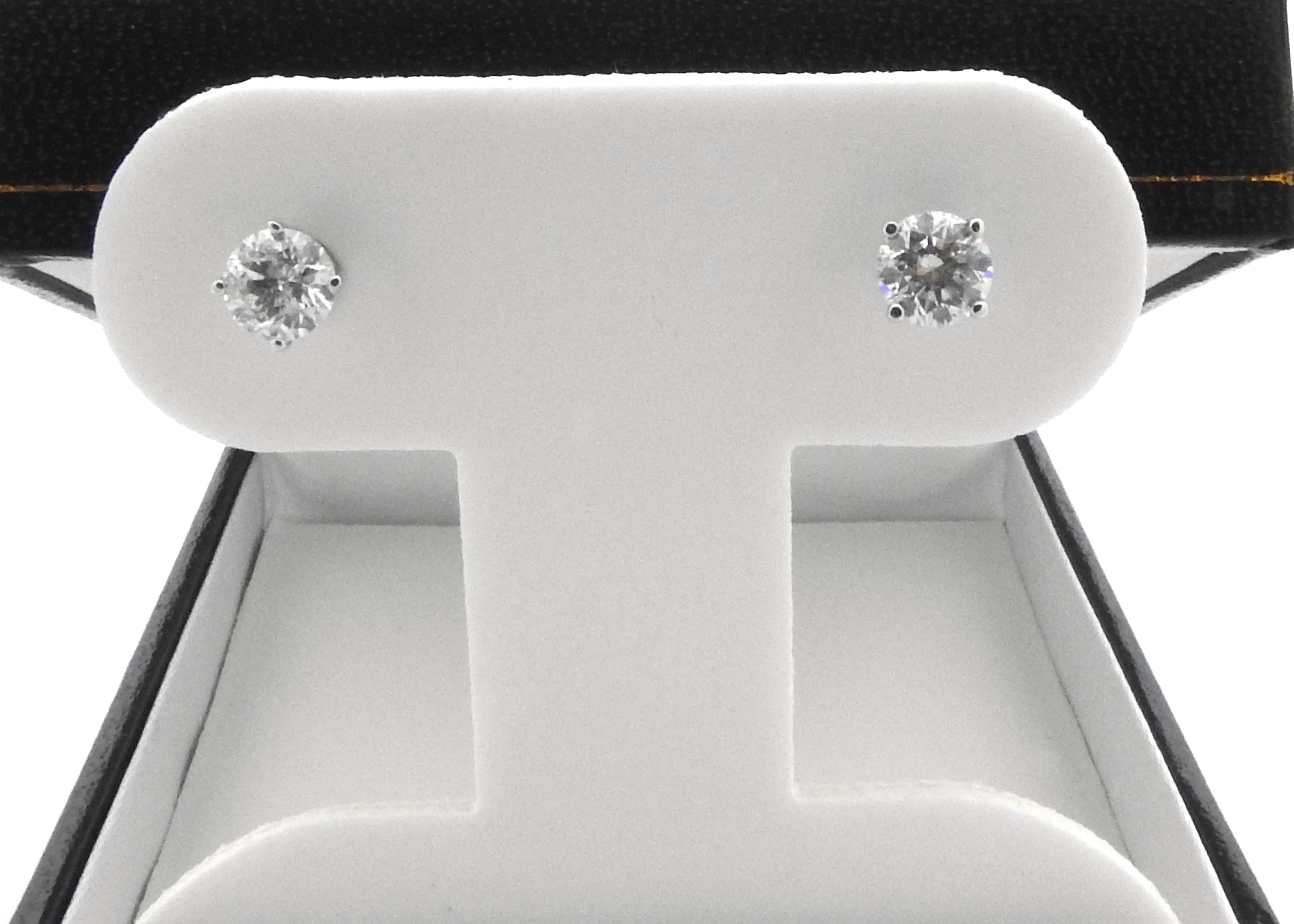 Vintage 14 Karat White Gold Diamond Stud Earrings-

These exquisite earrings each feature one round brilliant cut diamond set in classic 14K white gold. Screw back closures.

Approximate total diamond weight: 1.0 ct.

Diamond color: I-J

Diamond