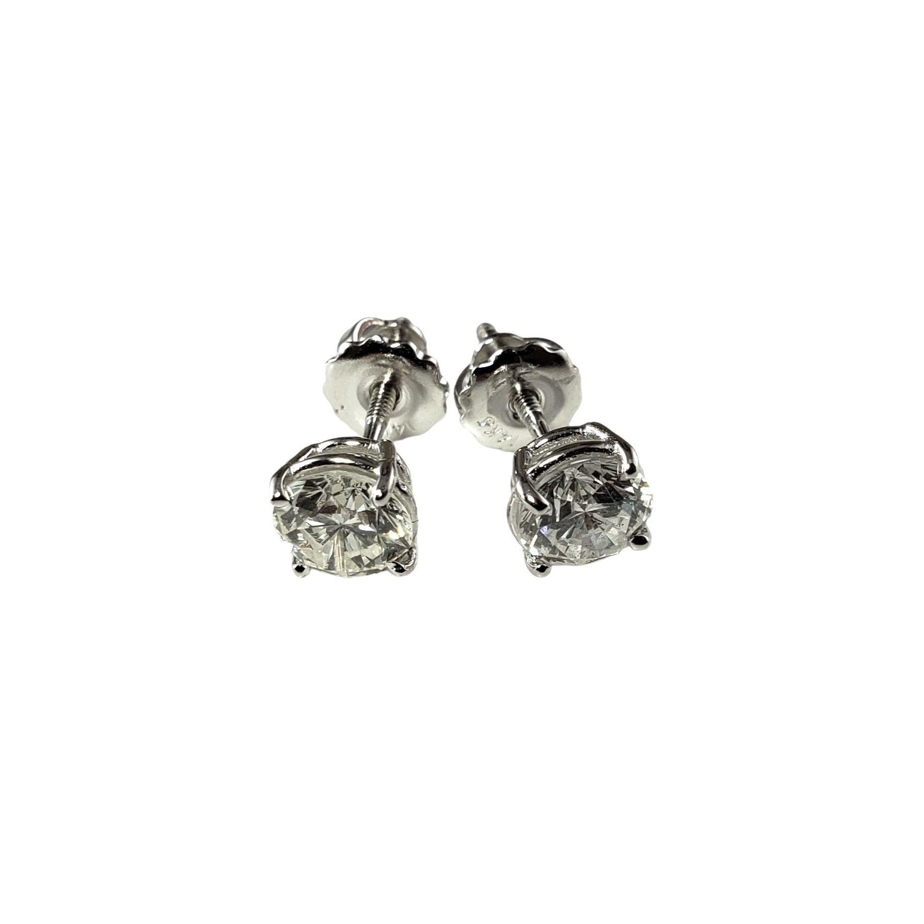 Vintage 14 Karat White Gold Diamond Stud Earrings 1.29 TCW.  JAGi Certified-

These sparkling earrings each feature one round brilliant cut diamond set in classic 14K white gold.  Screw back closures.

Total diamond weight: 1.29 ct.

Diamond color: 