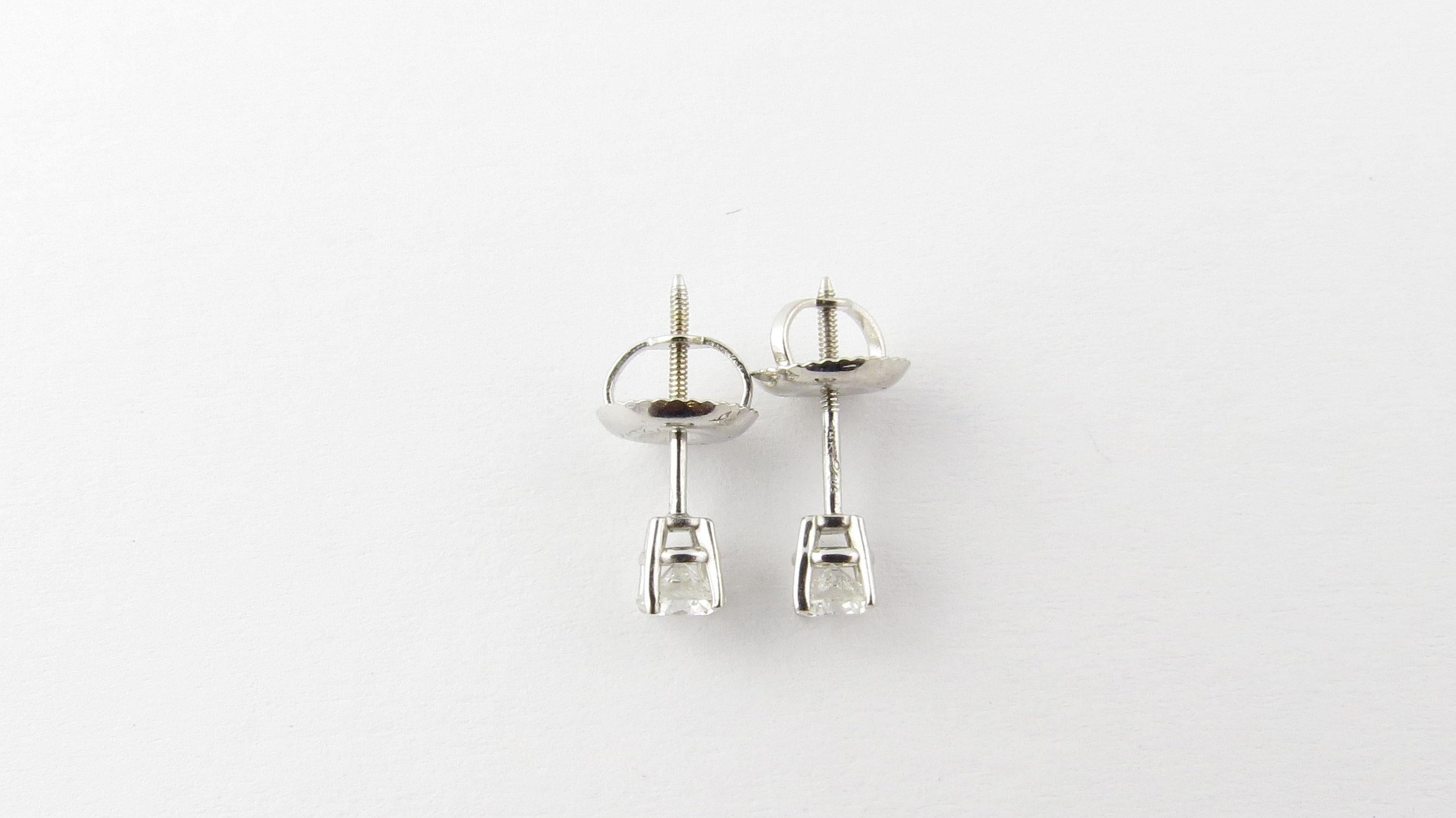 Vintage 14 Karat White Gold Diamond Stud Earrings .30 ct. twt.- 
These sparkling stud earrings each feature one round brilliant cut diamond (.15 ct.) set in classic 14K white gold. Screw back closures. 
Approximate total diamond weight: .30 ct.