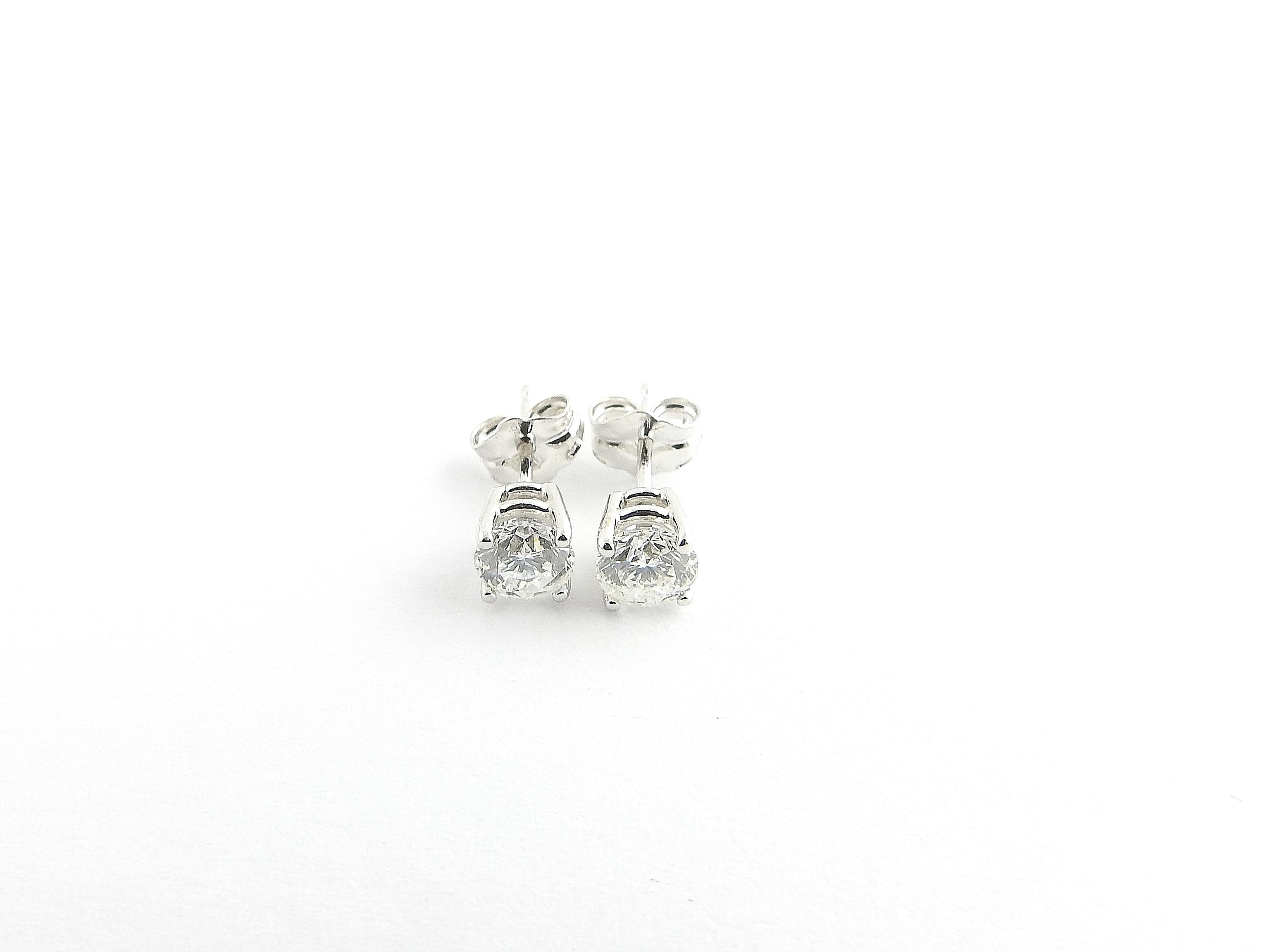 Vintage 14 Karat White Gold Diamond Stud Earrings .67 ct. twt.

These sparkling earrings each feature one round brilliant cut diamond set in classic 14K white gold. Push back closures.

Approximate total diamond weight: .67 ct.

Diamond color:
