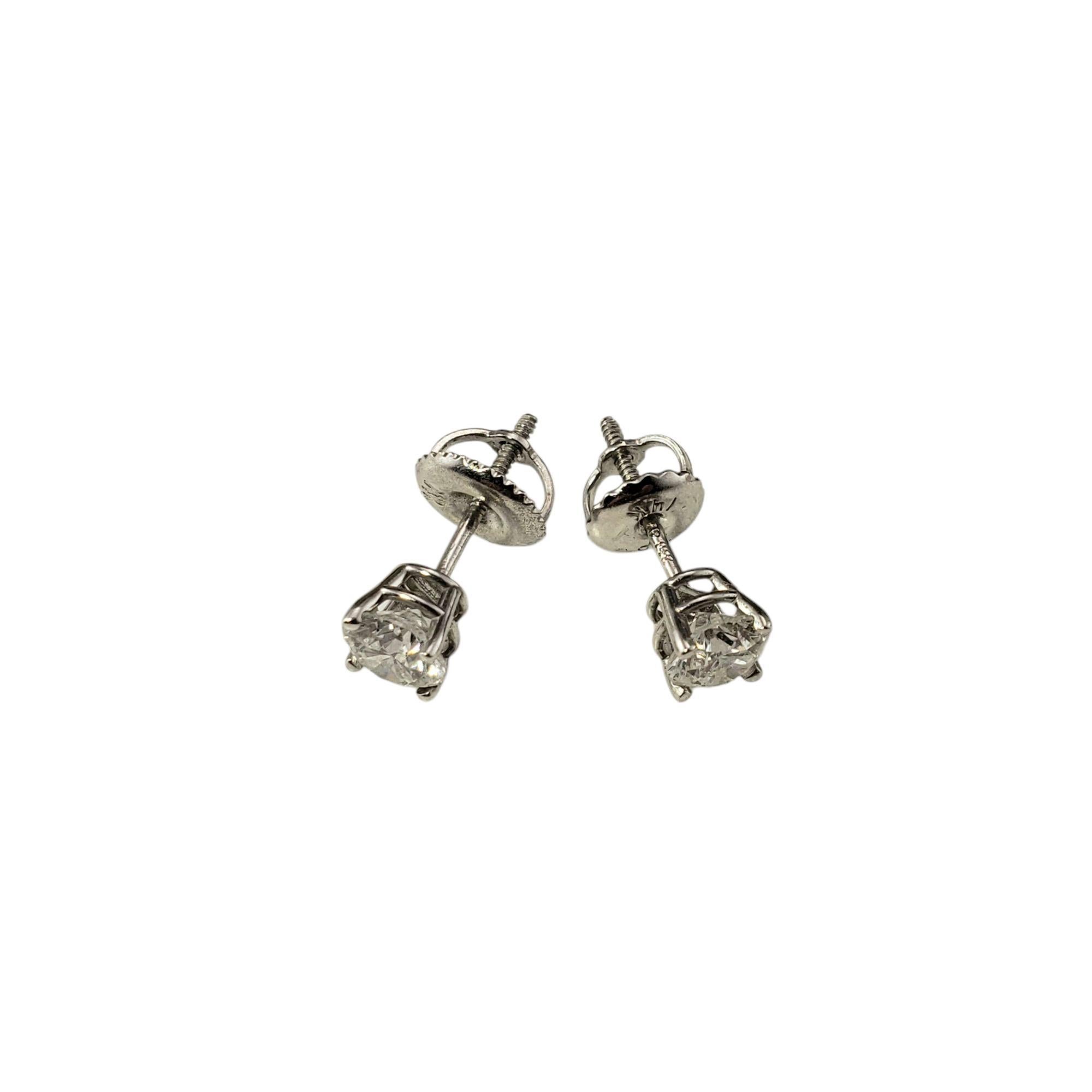 14 Karat White Gold Diamond Stud Earrings-

These sparkling stud earrings each feature one round brilliant cut diamond set in classic 14K white gold. Screw back closures.

Approximate total diamond weight: .70 ct.

Diamond color: I

Diamond clarity: