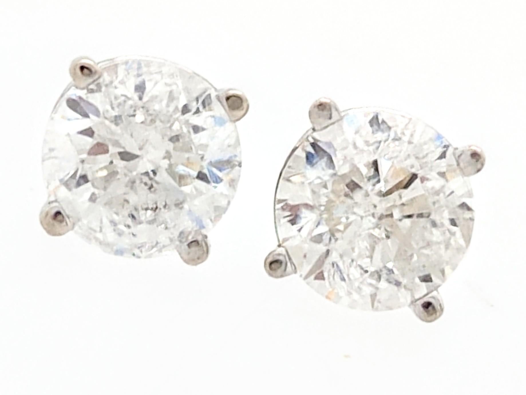 You are viewing a Beautiful Pair of Diamond Stud Earrings. These earrings are crafted from 14k white gold and weighs .9 grams. Each earring features (1) .37ct natural round diamond which measures approximately 4.6mm for an estimated .75tcw. The