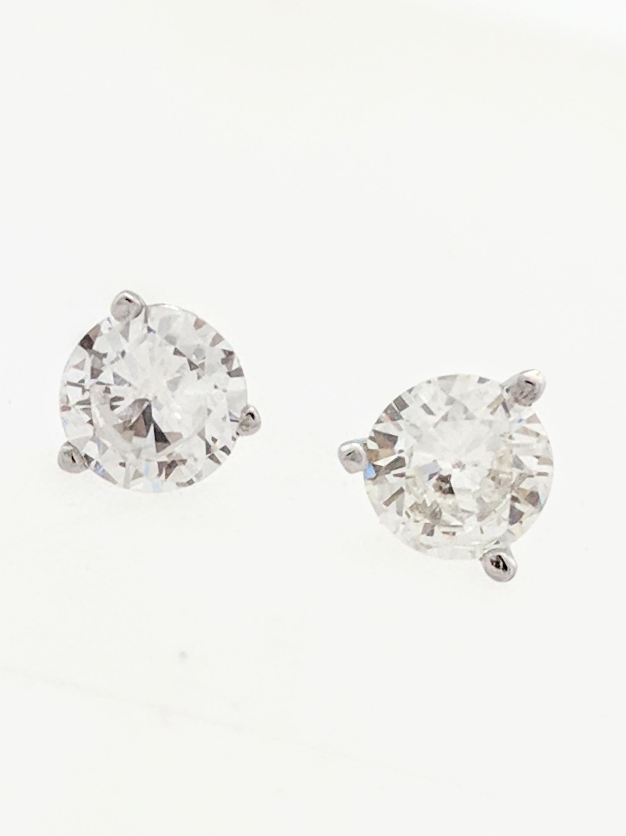 You are viewing a Beautiful Pair of Diamond Stud Earrings. These earrings are crafted from 14k white gold and weighs .9 grams. Each earring features approximately (1) .40ct natural round diamond which measures 5mm for an estimated .80tcw. The