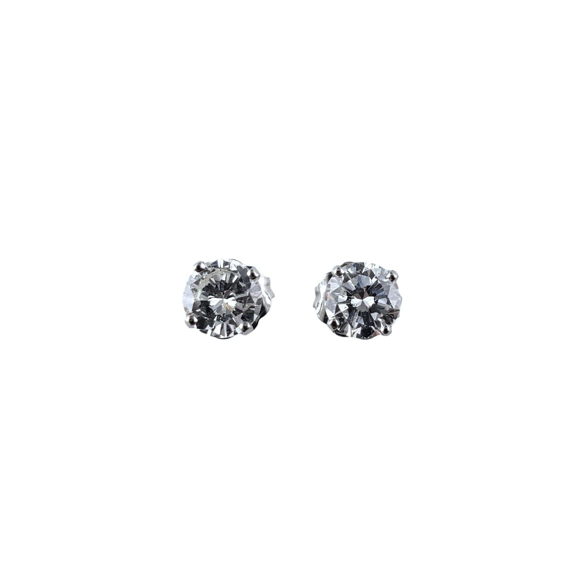 Women's 14 Karat White Gold Diamond Stud Earrings .90 TCW. #14047