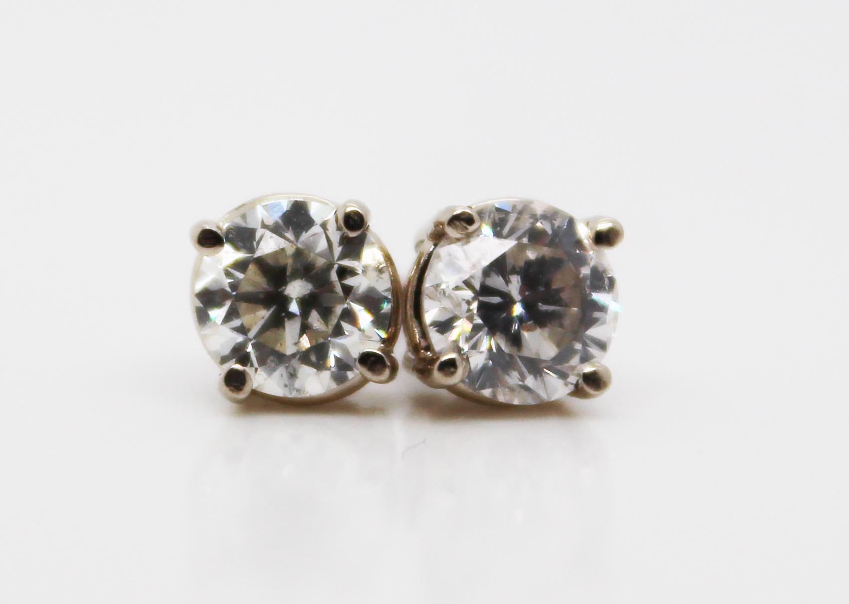 These stunning stud earrings are in 14k white gold and feature breathtaking white diamond centers! The diamonds are almost perfectly matched and big enough for their sparkle to be seen from across the room! These earrings are the diamond staple that