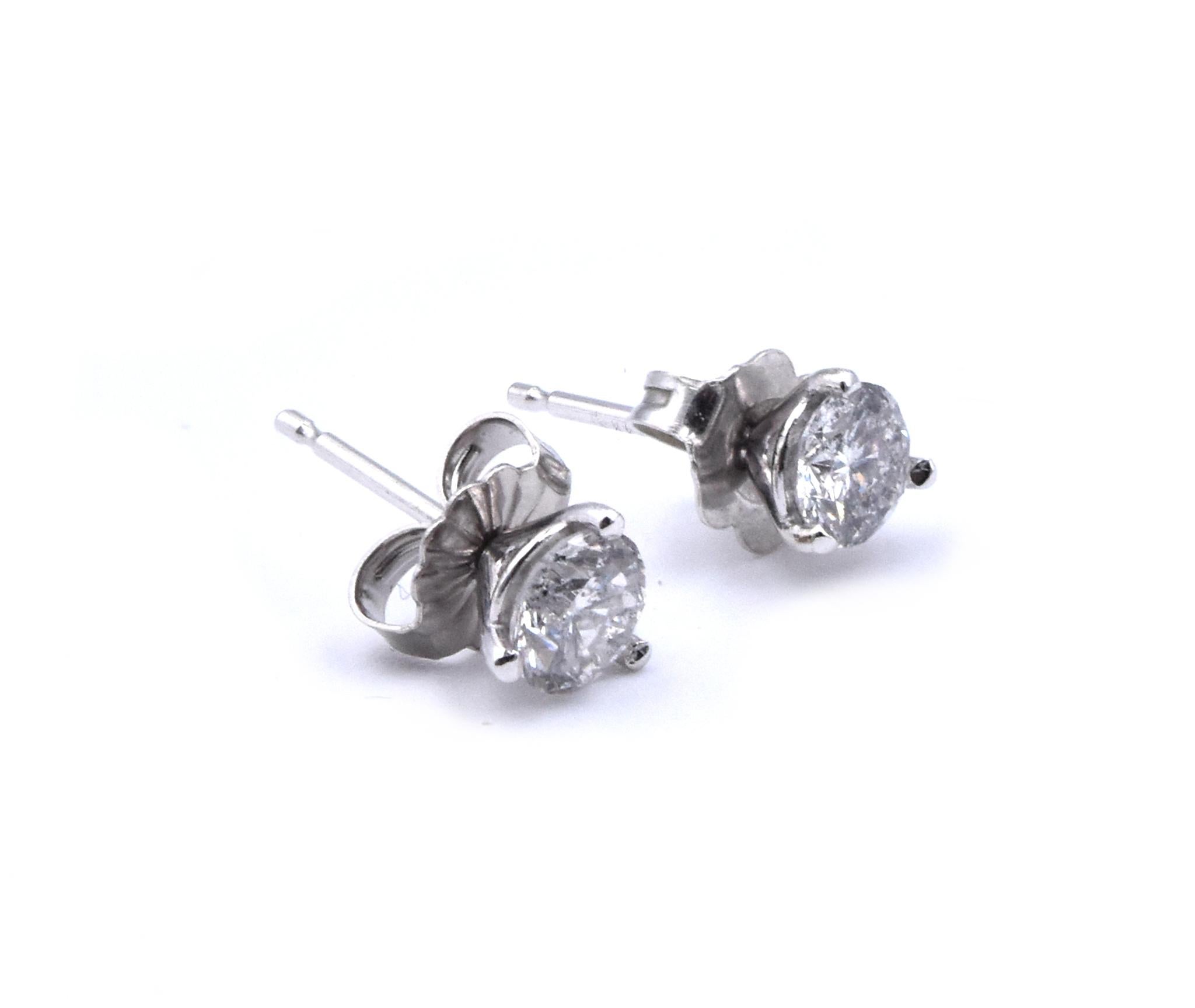 Material: 14k white gold
Diamond: 2 round brilliant cut = .80cttw
Color: G
Clarity: I1
Dimensions: earrings measure approximately 5.06mm in diameter
Fastenings: post with friction backs
Weight:  .55 grams
