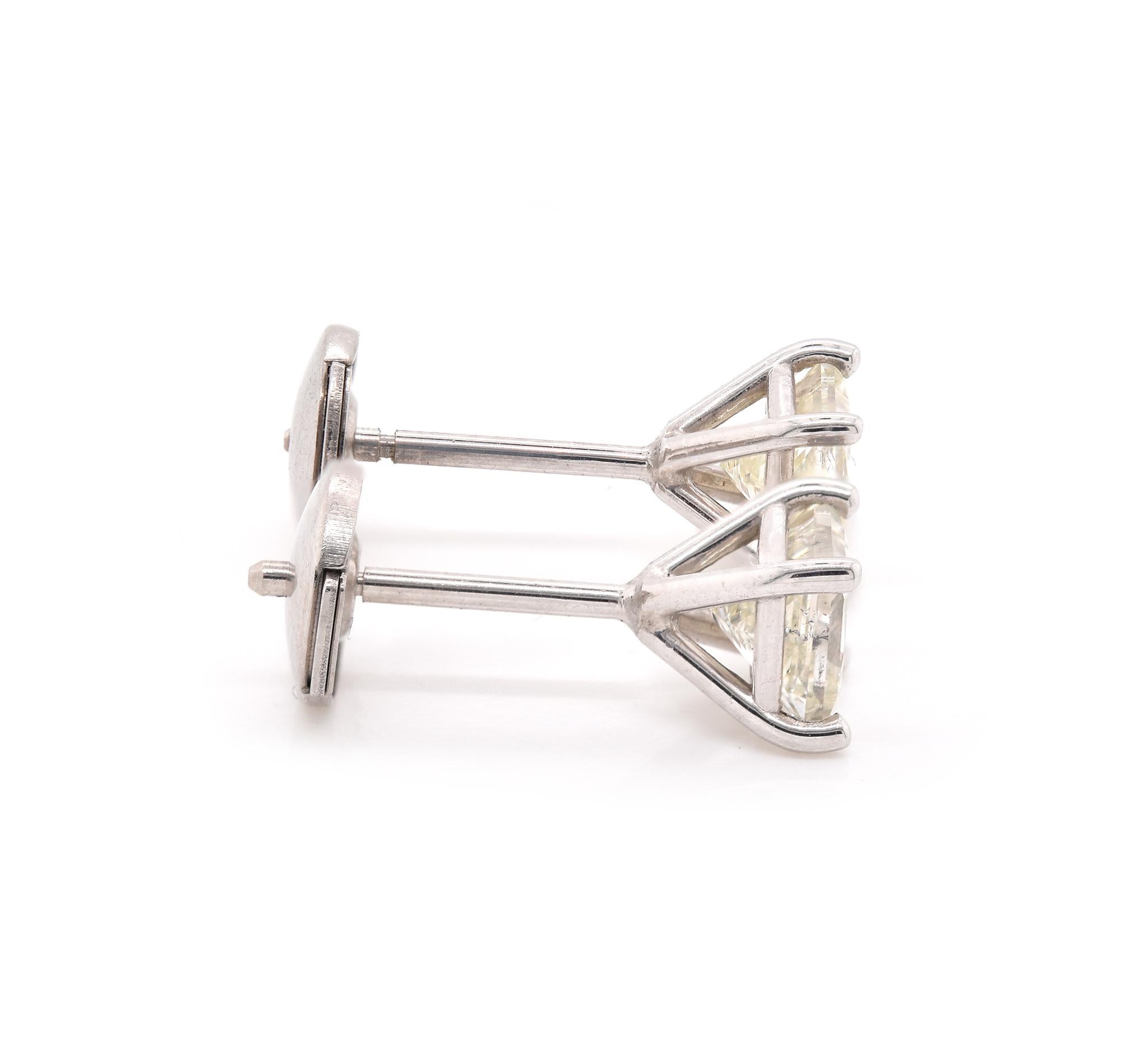 Material: 14k white gold
Diamond: 2 princess cut = 1.08cttw
Color: J
Clarity: SI2
Dimensions: earrings measure approximately  5.3mm in diameter
Fastenings: post with la pousette backs
Weight: 1.27 grams

