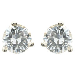 Clous d'oreilles en or blanc 14 carats et diamants