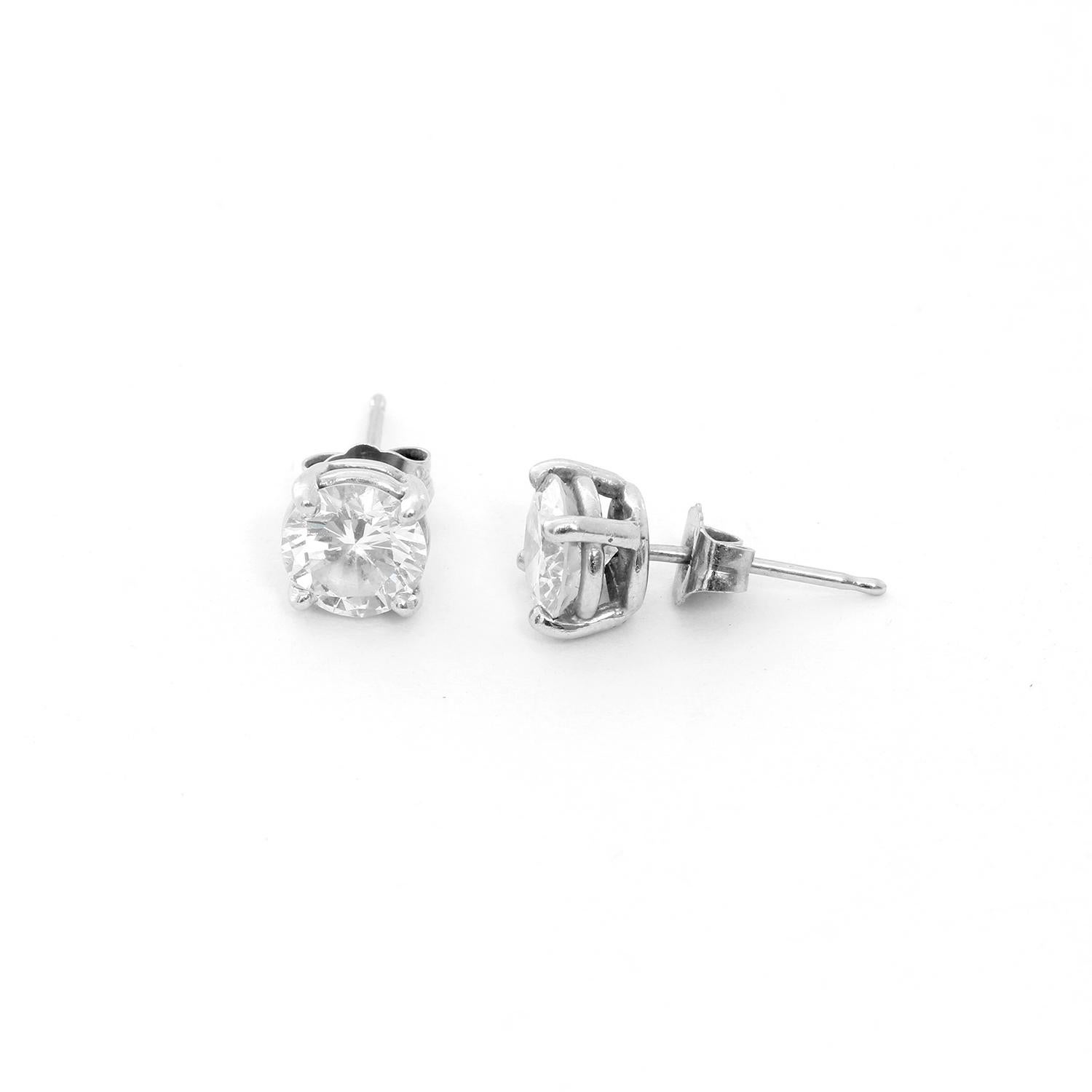 14K White Gold Diamond Studs  - Pair of diamond studs weighing .95 cts  with F color and VS-2 clarity and the other weighing .97 cts with G color and VS-2 clarity set in a handmade prong. Comes with a valuation from Christies Auction House.