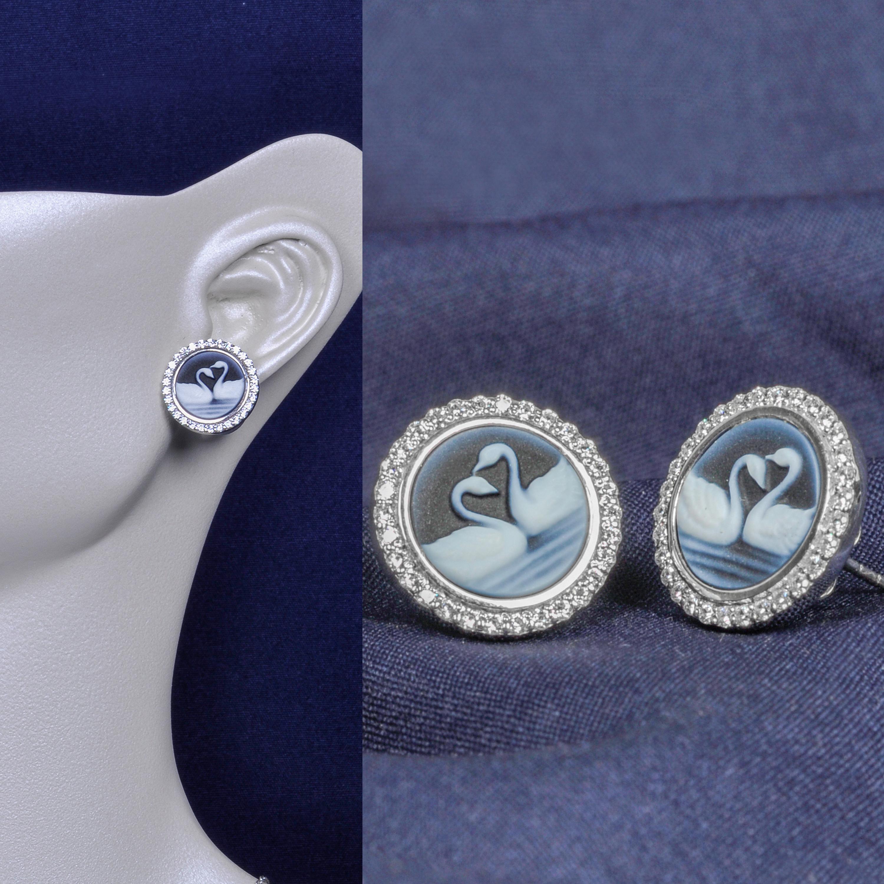 These exquisite stud earrings feature an intricate swan couple cameo, delicately carved on natural agate sourced from Brazil. The swans, symbols of grace and eternal love, are beautifully detailed, capturing their elegant form and serene demeanor.