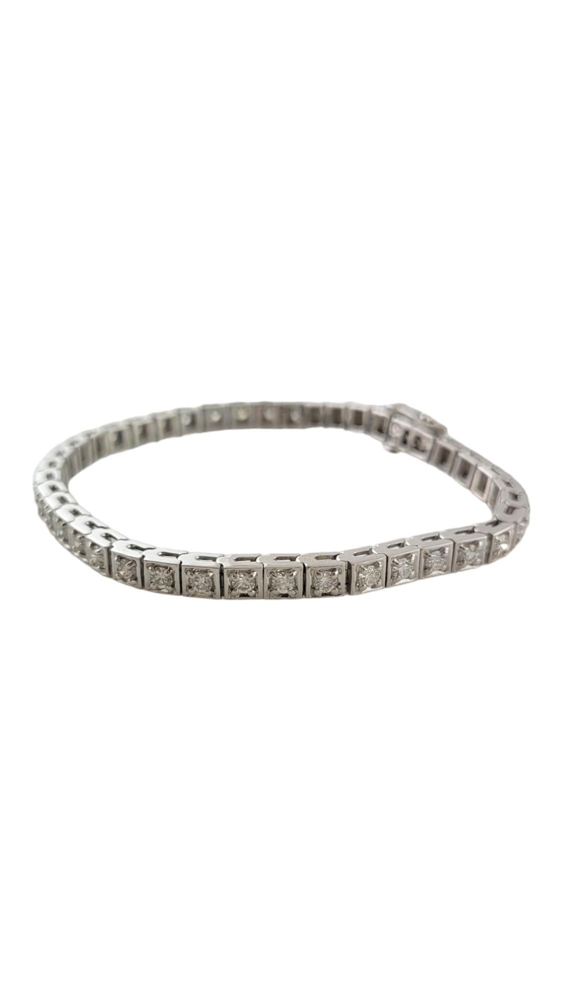 This sparkling bracelet features 41 round brilliant cut diamonds set in classic 14K white gold.  Width:  4 mm.

Approximate total diamond weight:  2.50 ct.

Diamond clarity: VS2

Diamond color: I

Size: 6.5 inches

Weight:  11.3 dwt. /  17.6