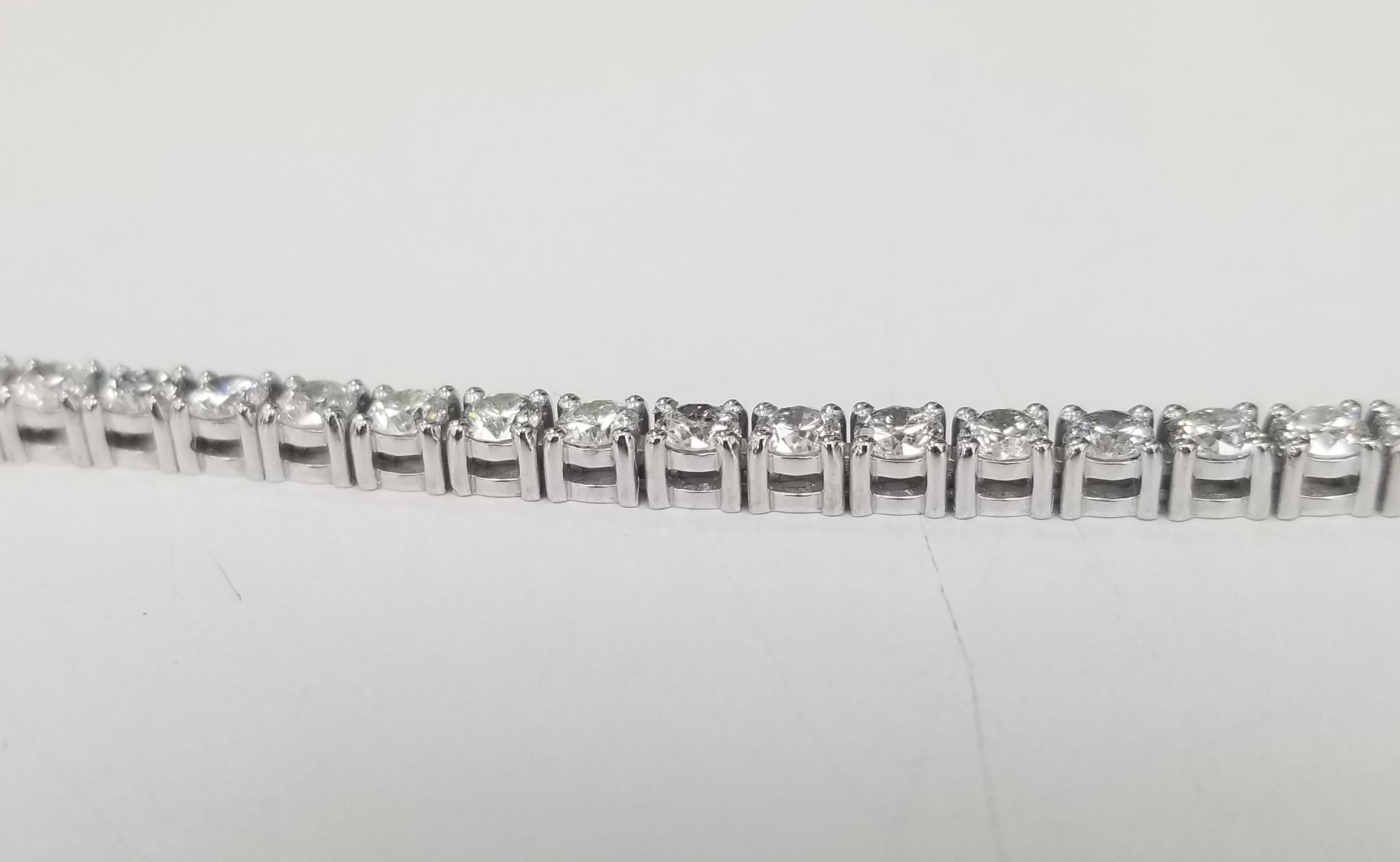  Specifications:
    DIAMOND: 49 ROUND CUT DIAMOND
    carat total weight:  APPROX 5.75CTW
    color: G
    clarity: VS2-SI1
    brand: custom
    metal: 14K WHITE gold
    type: TENNIS BRACELET
    weight: 11.5 grS
    SIZE: 7 INCH
    hallmark: