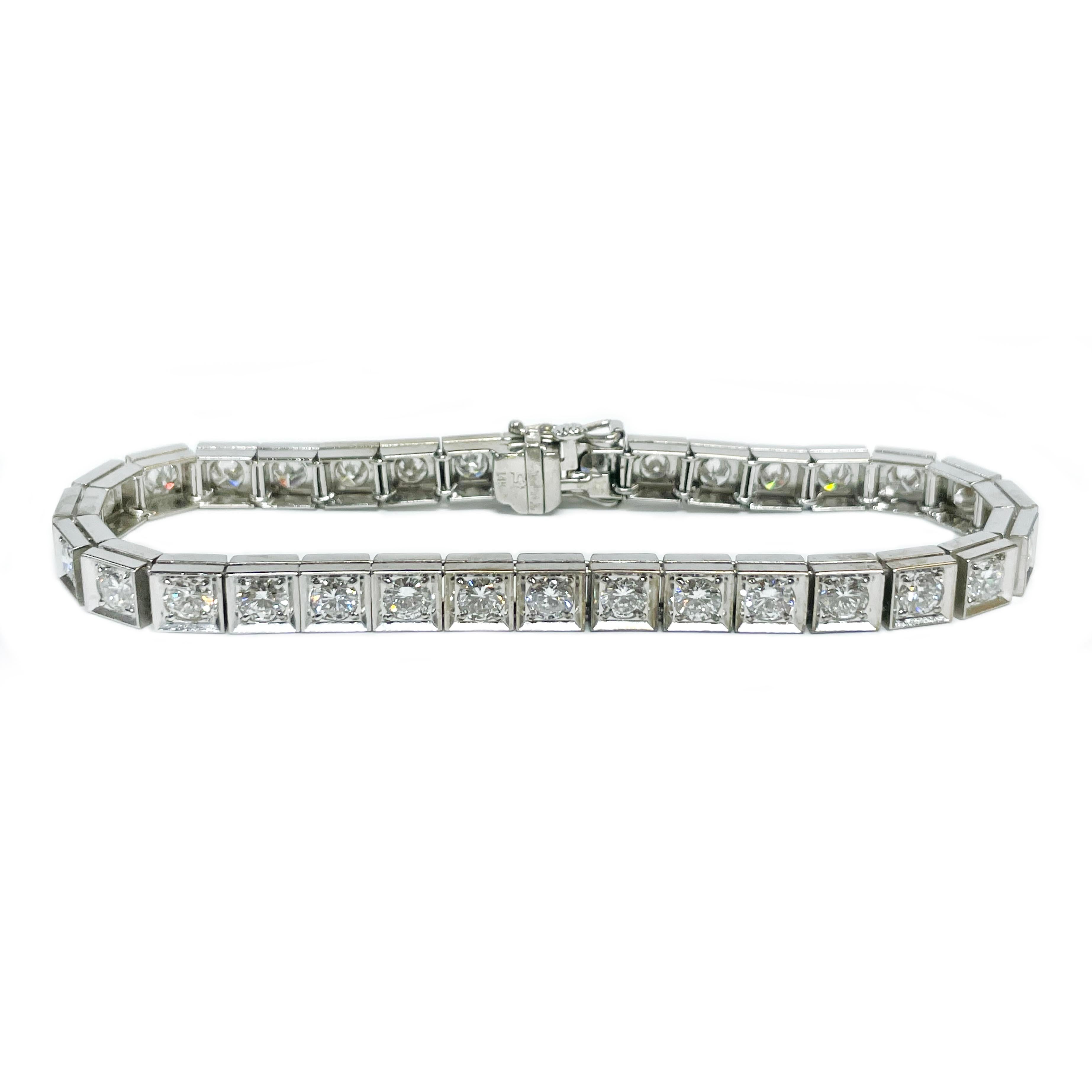 14 Karat White Gold Diamond Tennis Bracelet. The stunning bracelet features thirty-two round bead-set diamonds. The diamonds measure 3.6mm - 3.7mm and have a total carat weight of 5.5ctw. The diamonds are SI in clarity (G.I.A.) and G-H in color