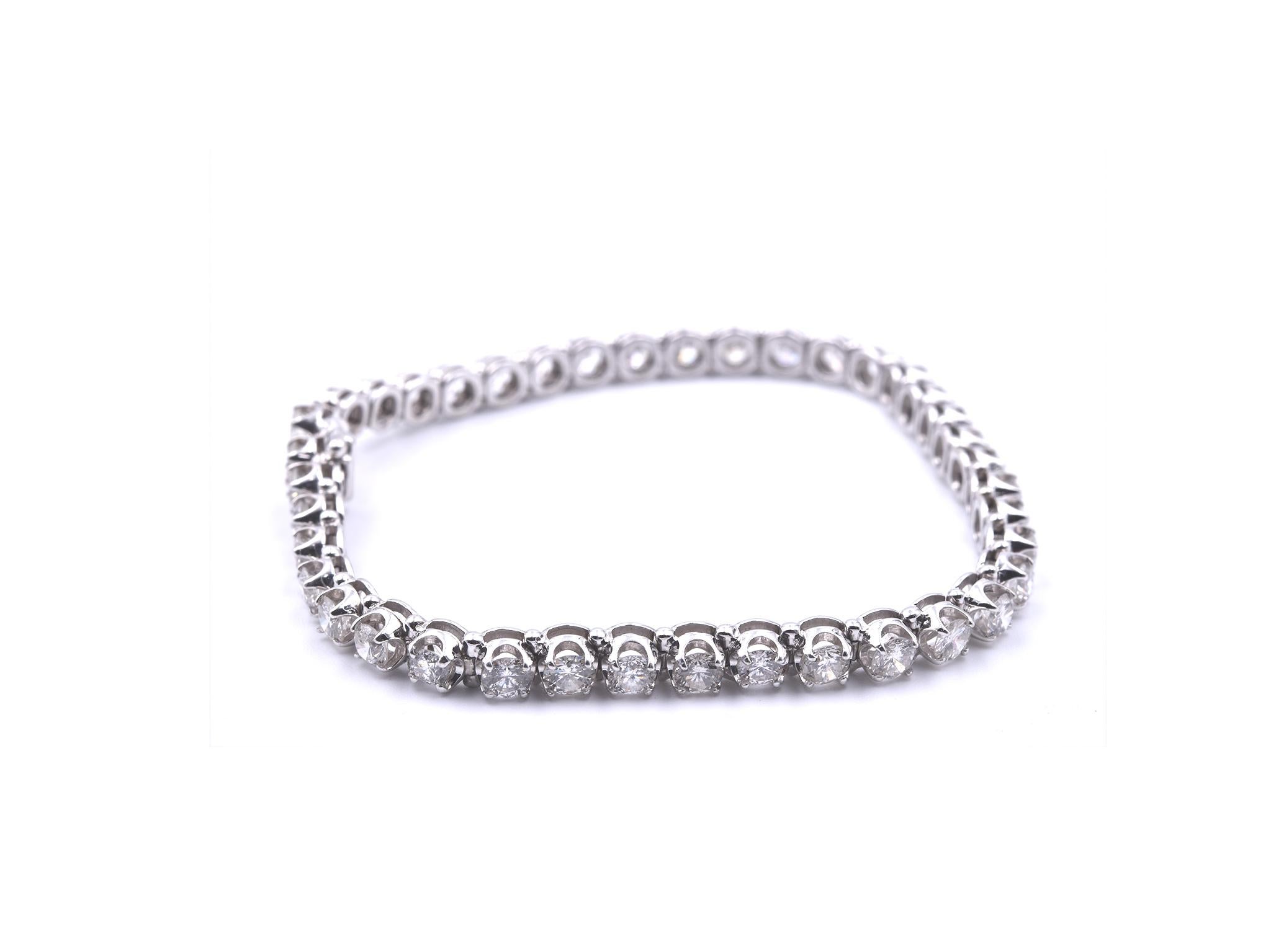 Designer: custom designed
Material: 14k white gold
Diamonds: 40 round brilliant cut = 6.80cttw
Color: G
Clarity: SI1
Dimensions: bracelet measures 7 ¼ inches mm wide and is 4.15mm wide
Weight: 12.05 grams
