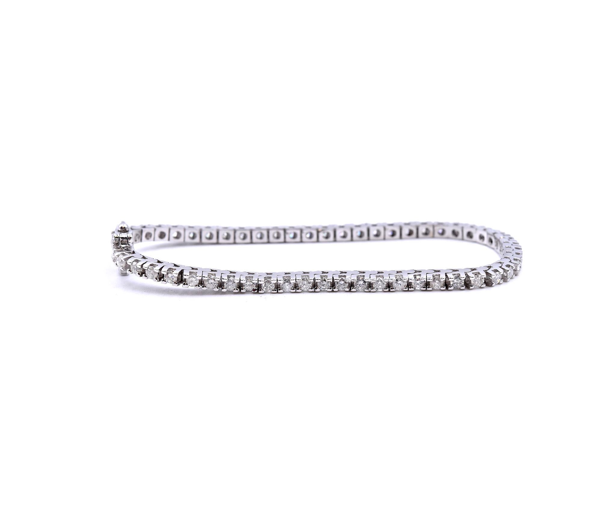 Designer: custom
Material: 14K white gold
Round Diamonds: 55 round brilliant cuts = 2.25cttw
Color: G
Clarity: SI3
Dimensions: the bracelet measures 7-inches in length 
Weight: 12.1 grams
